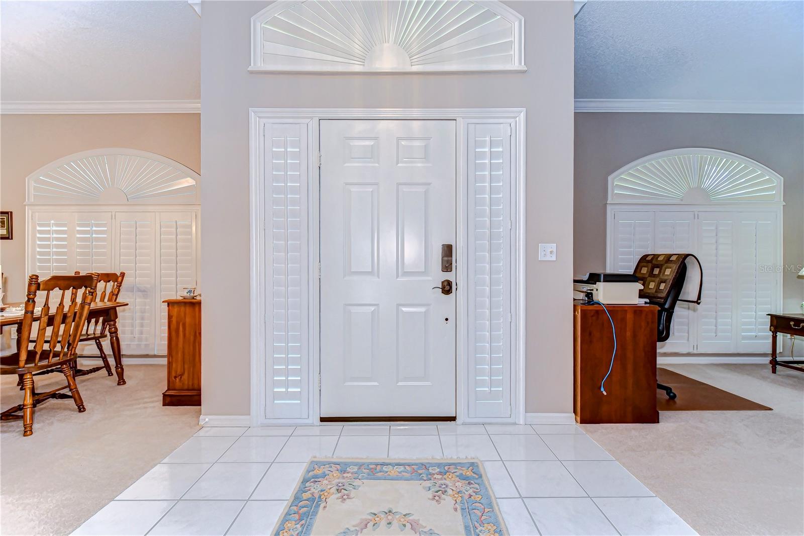 Step through the inviting entrance into a realm of natural light, courtesy of grand arched windows that whisper sophistication.