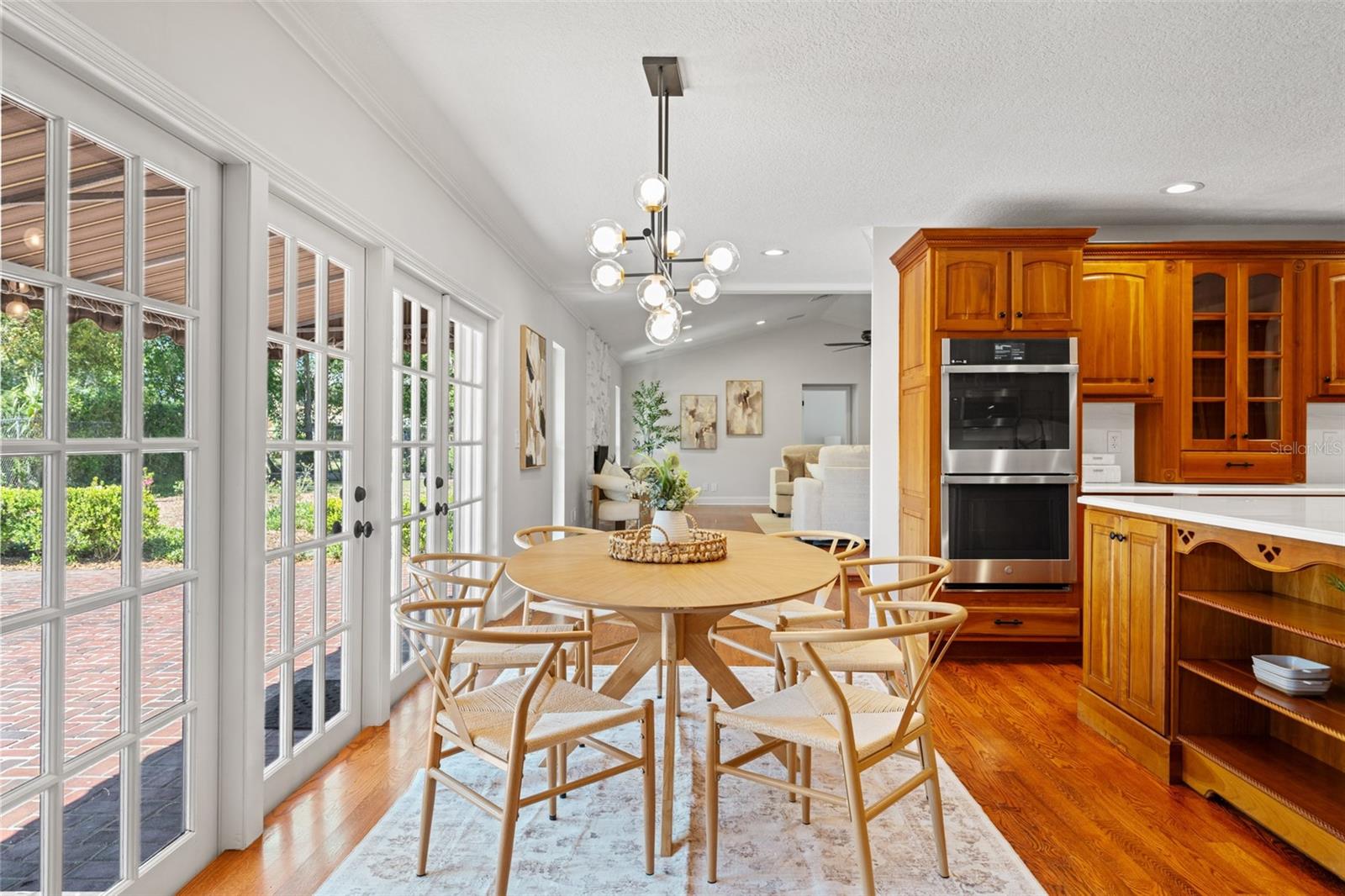 Breakfast Room Opens to Enormous Brick Patio and Wrought Iron Gates.