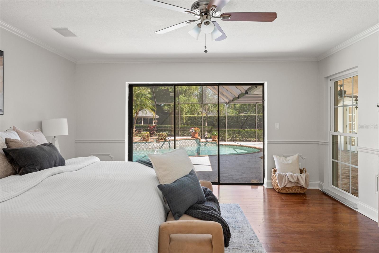 Primary Bedroom Opens to Enclosed Lanai and Pool