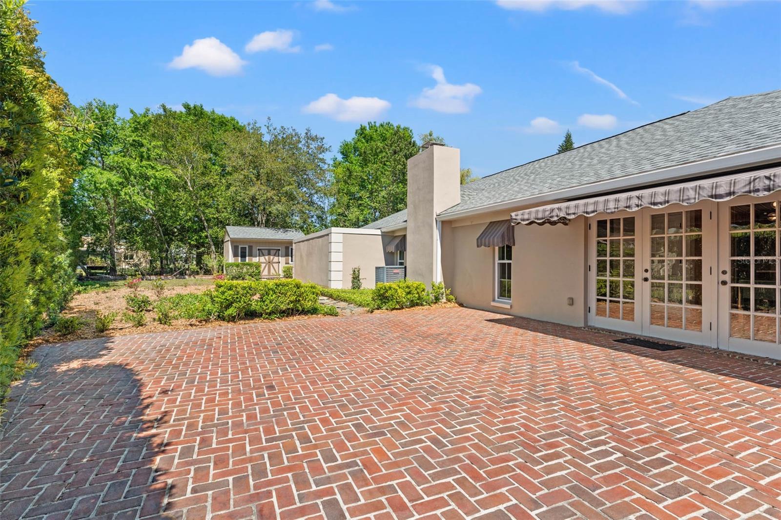 Sprawling Brick Patio for Outdoor Dining and Seating