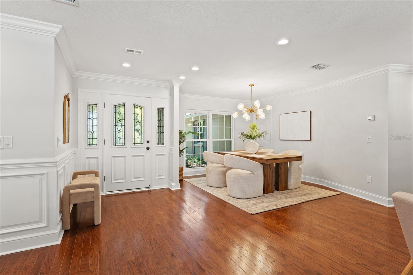 Foyer Opens to Sunlit Open Dining/ Living Room