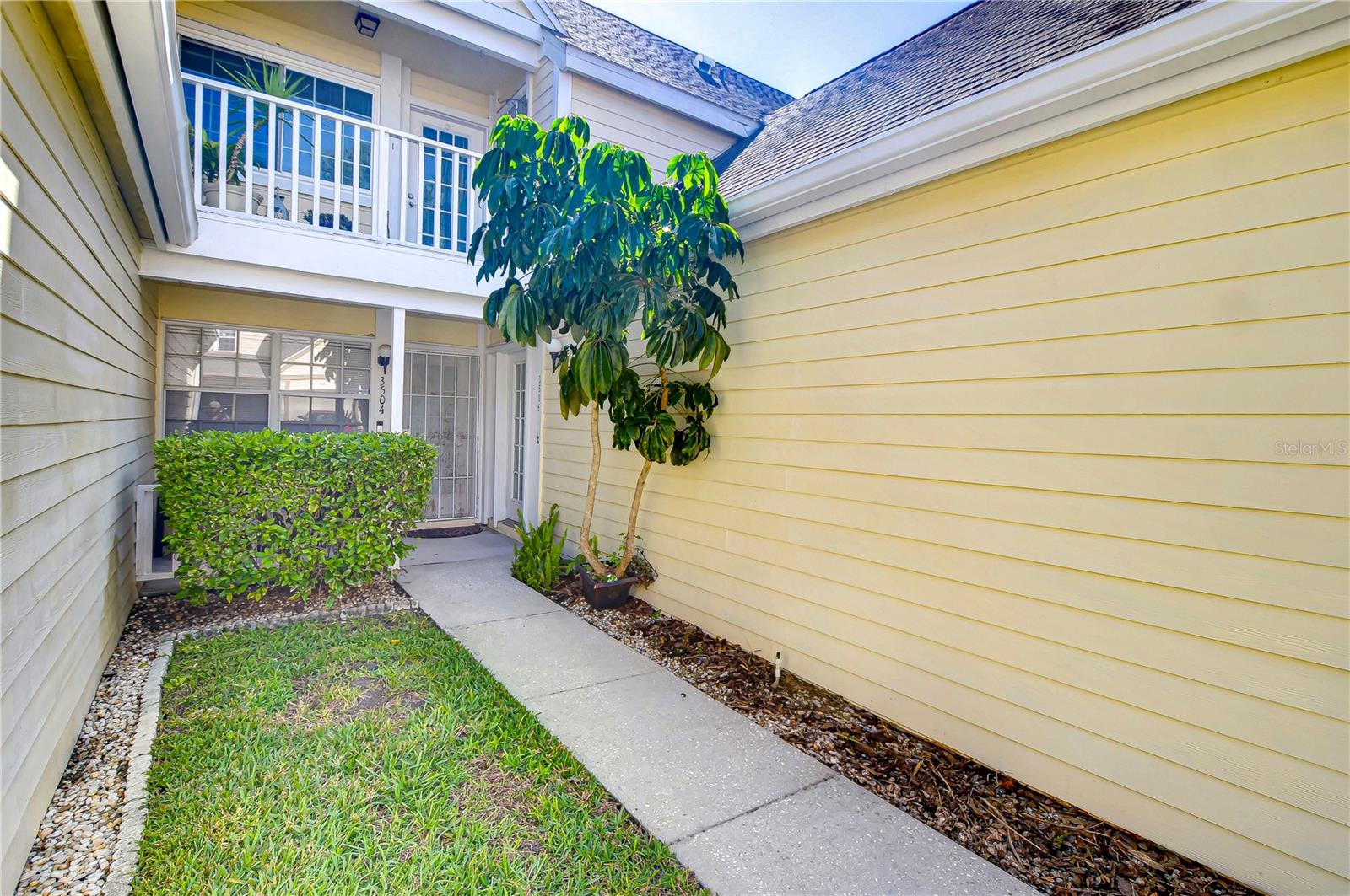 Discover tranquility right at your doorstep with this charming entryway, inviting you into a unique retreat.