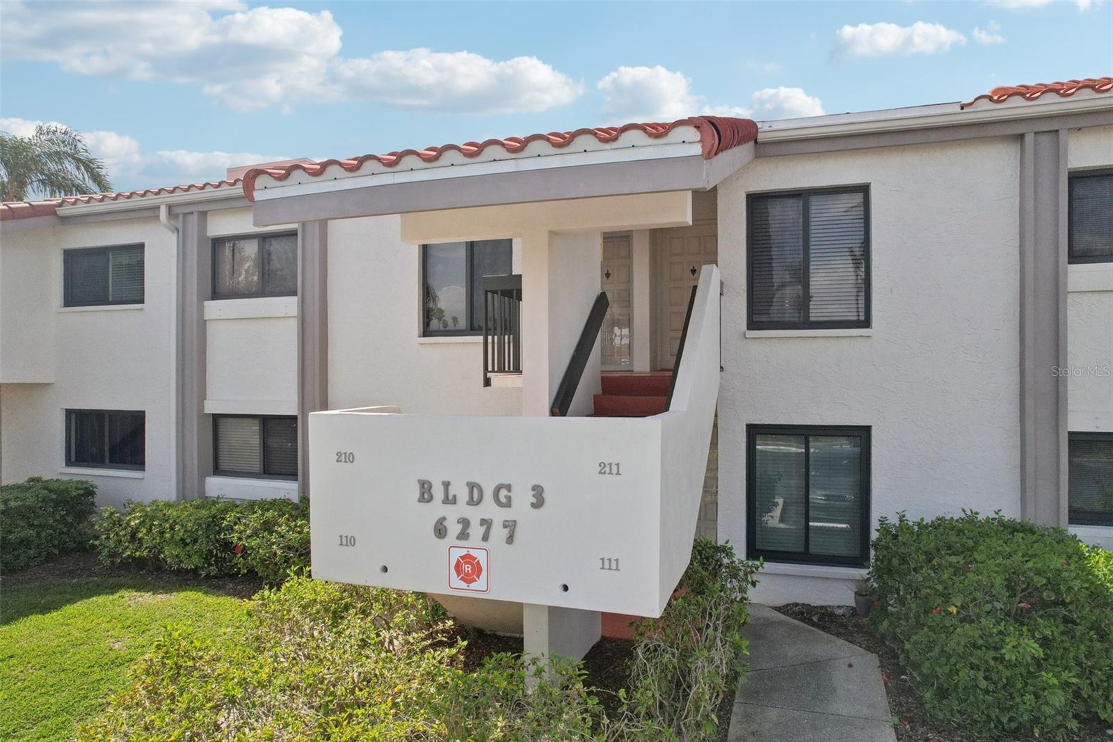 Front door - parking spot is just steps away. The mailbox is very close and convenient, too. Easy living!