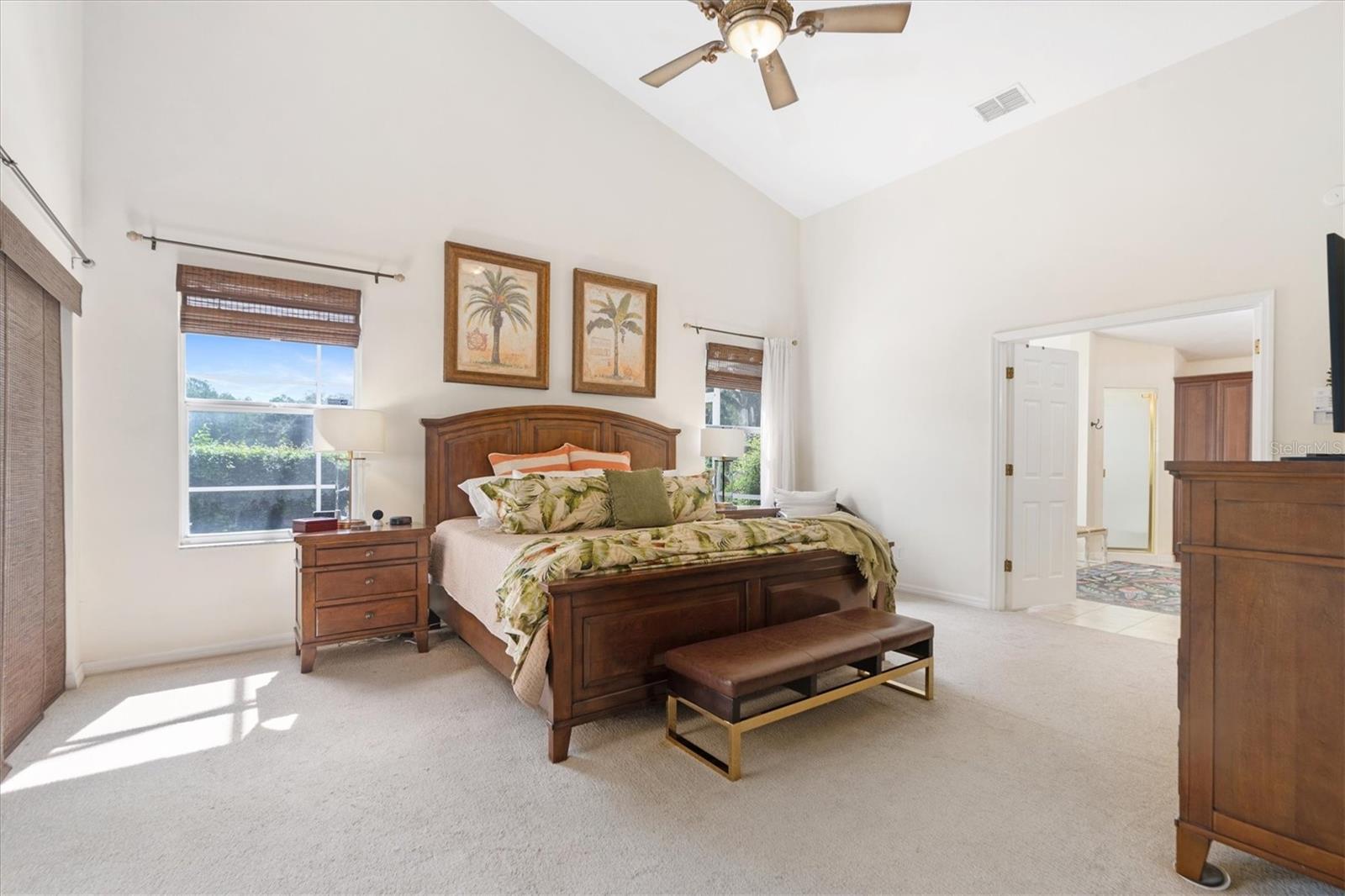 Primary Bedroom w/Double Doors to Ensuite and Sliding Doors to Outdoor Pool Area