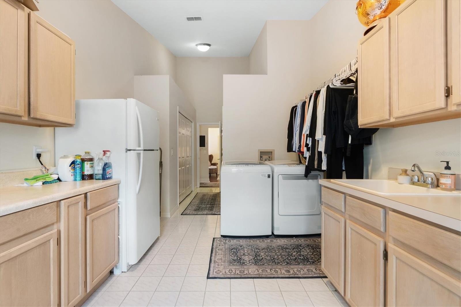 Laundry Room with Sink, Abundance of Cabinet Space, and 2 Closets