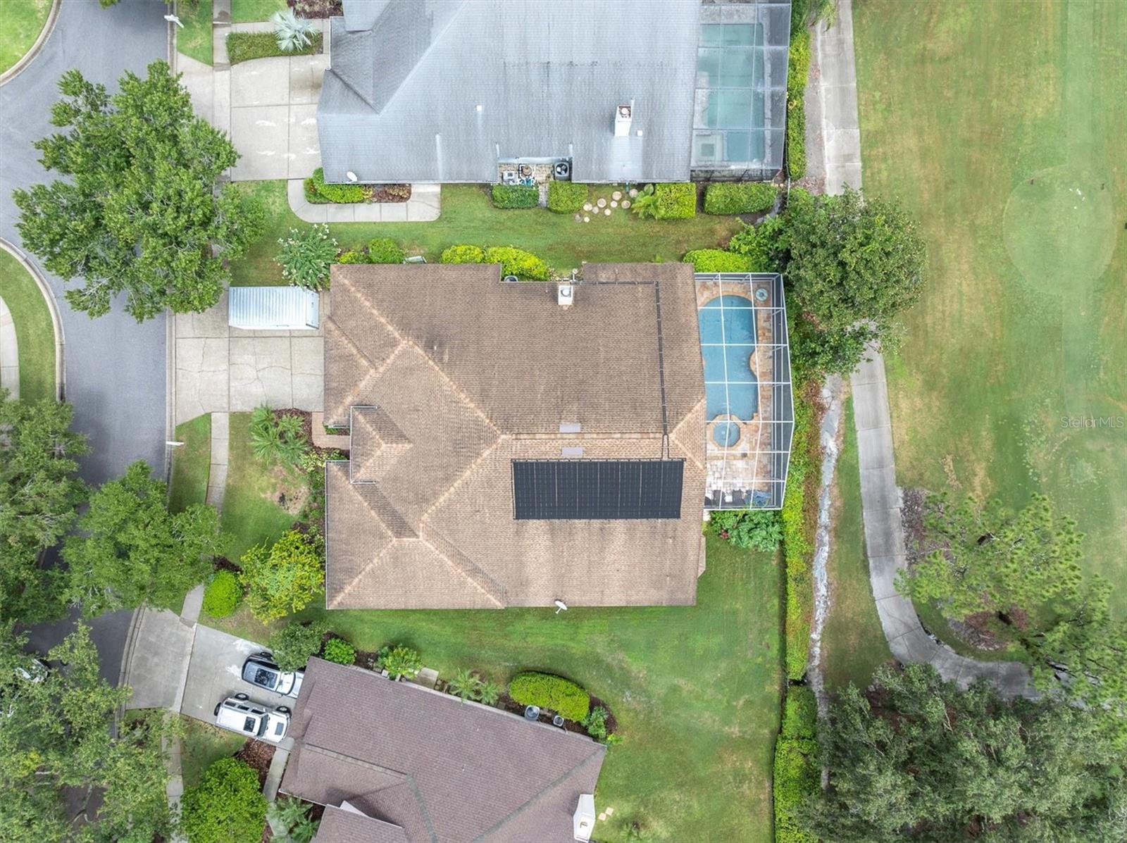 Beautiful Overhead View Showing Solar Panels to Heat Sunsation Pool