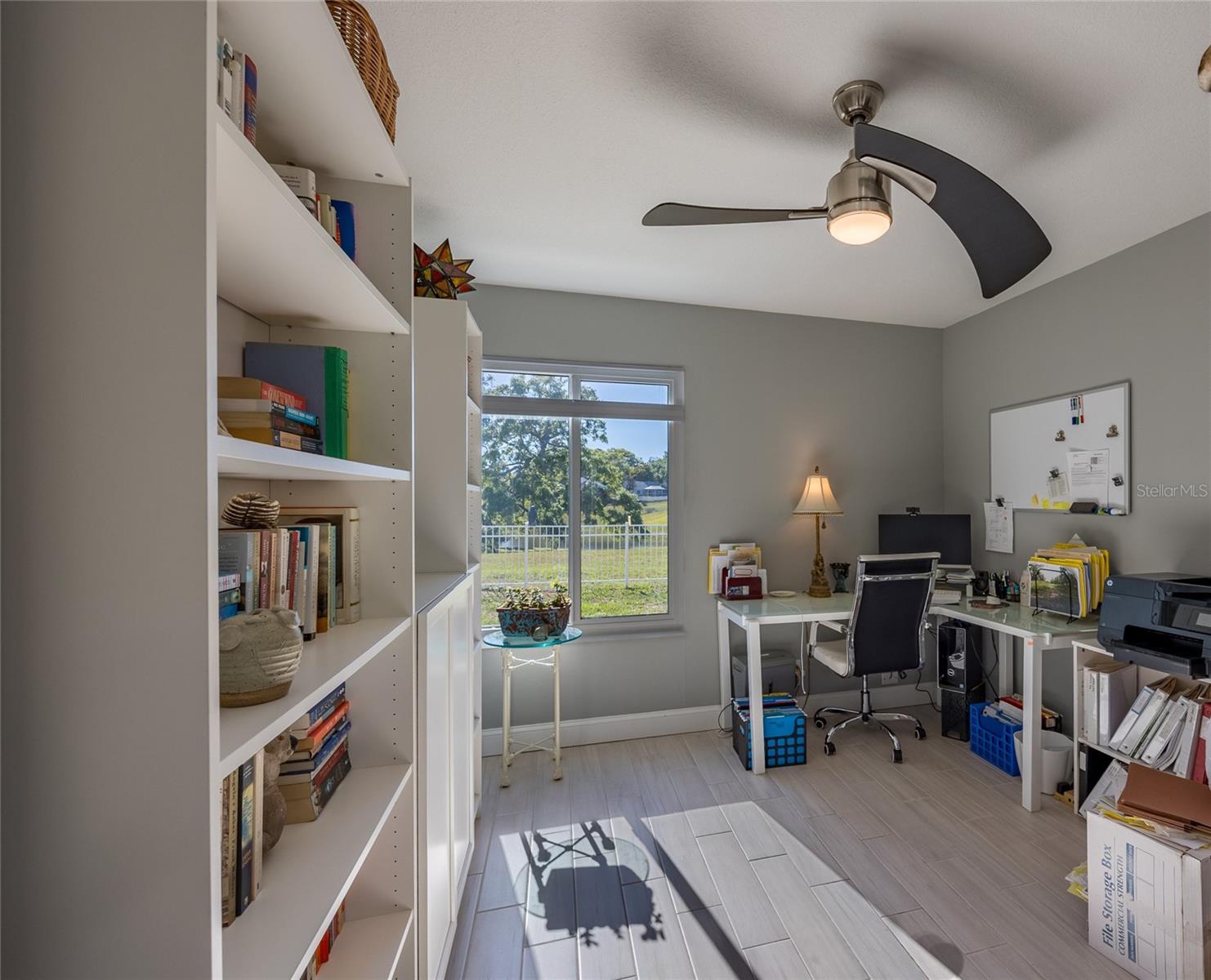 UPDOWN SHADE IN THE OFFICE/3RD BEDROOM THAT OVERLOOKS THE POOL AND POND!  AND, AN AMAZING CEILING FAN!