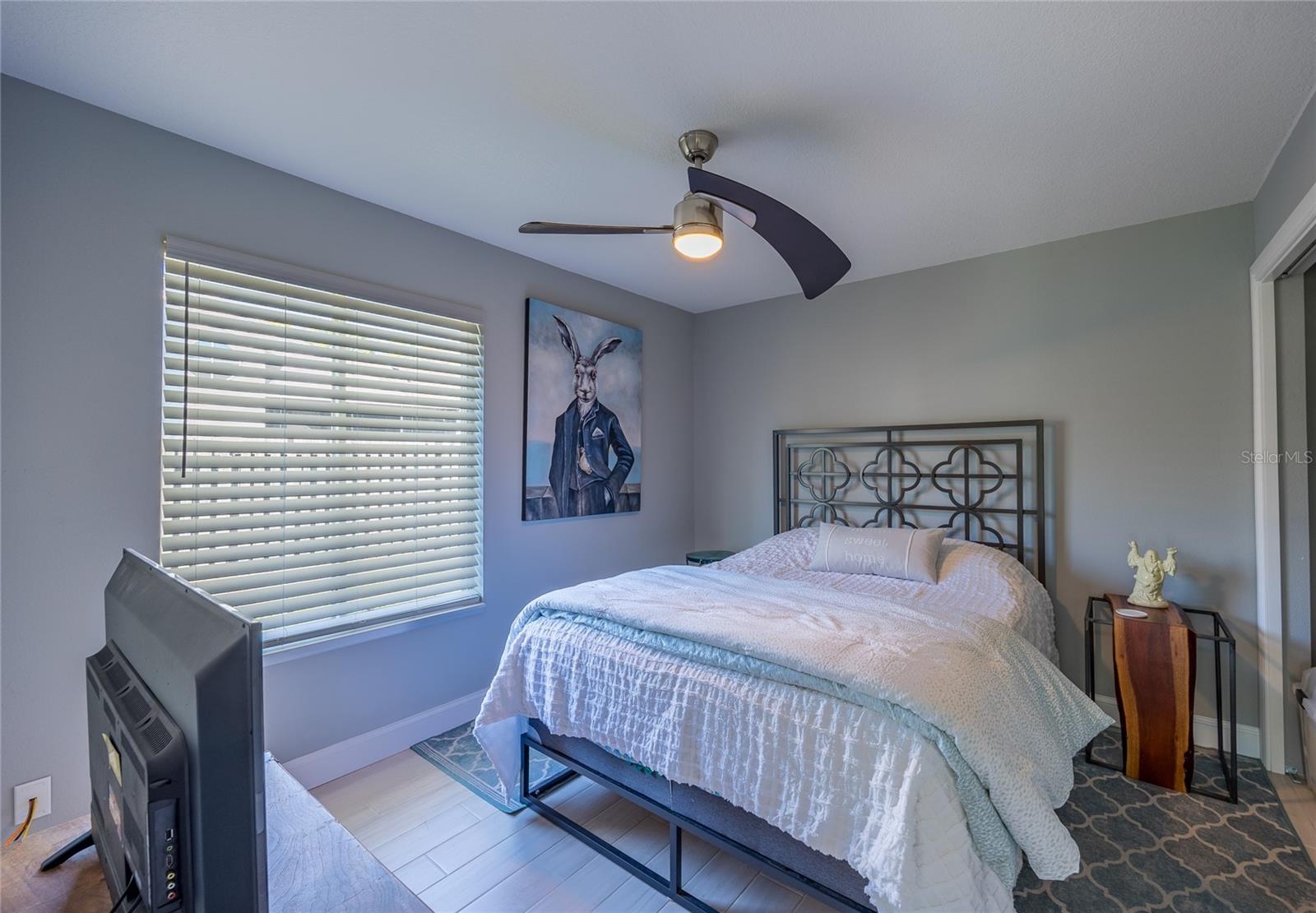 THE SECOND BDRM HAS THE SAME CUSTOM DESIGNER CEILING FAN WITH LIGHT AND 2" BLINDS!