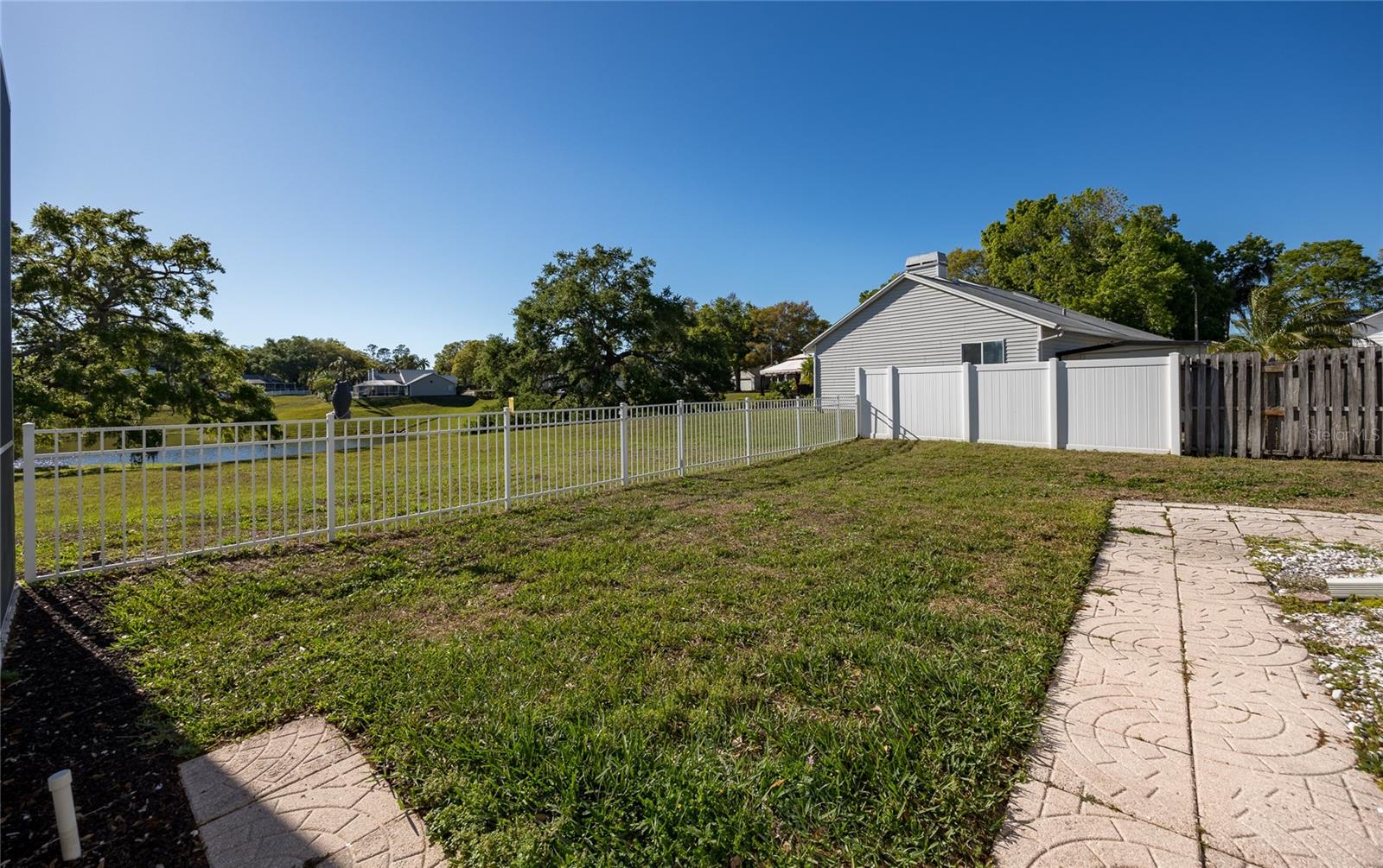 HUGE SIDE YARD THAT IS FENCED FOR YOUR PETS!