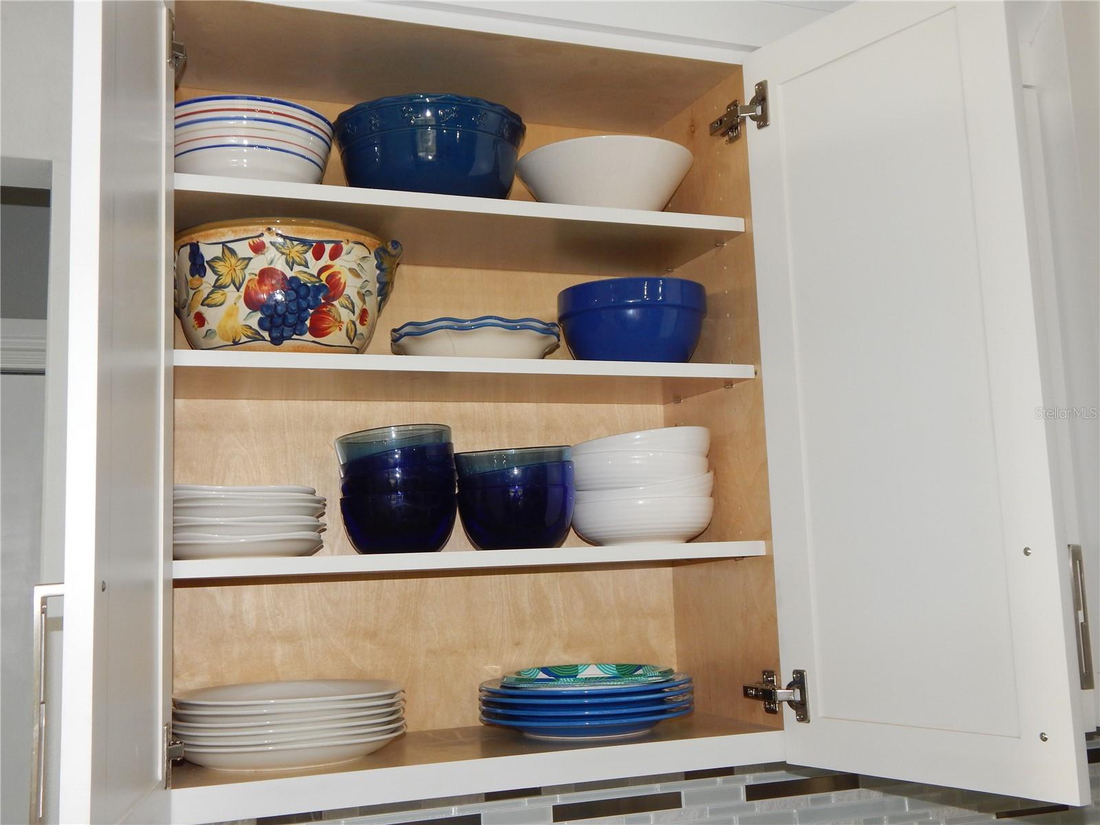 THE CABINETS ARE FITTED WITH 4 SHELVES. ADJUST THE TOP 3 TO ACCOMMODATE YOUR DISHES!!