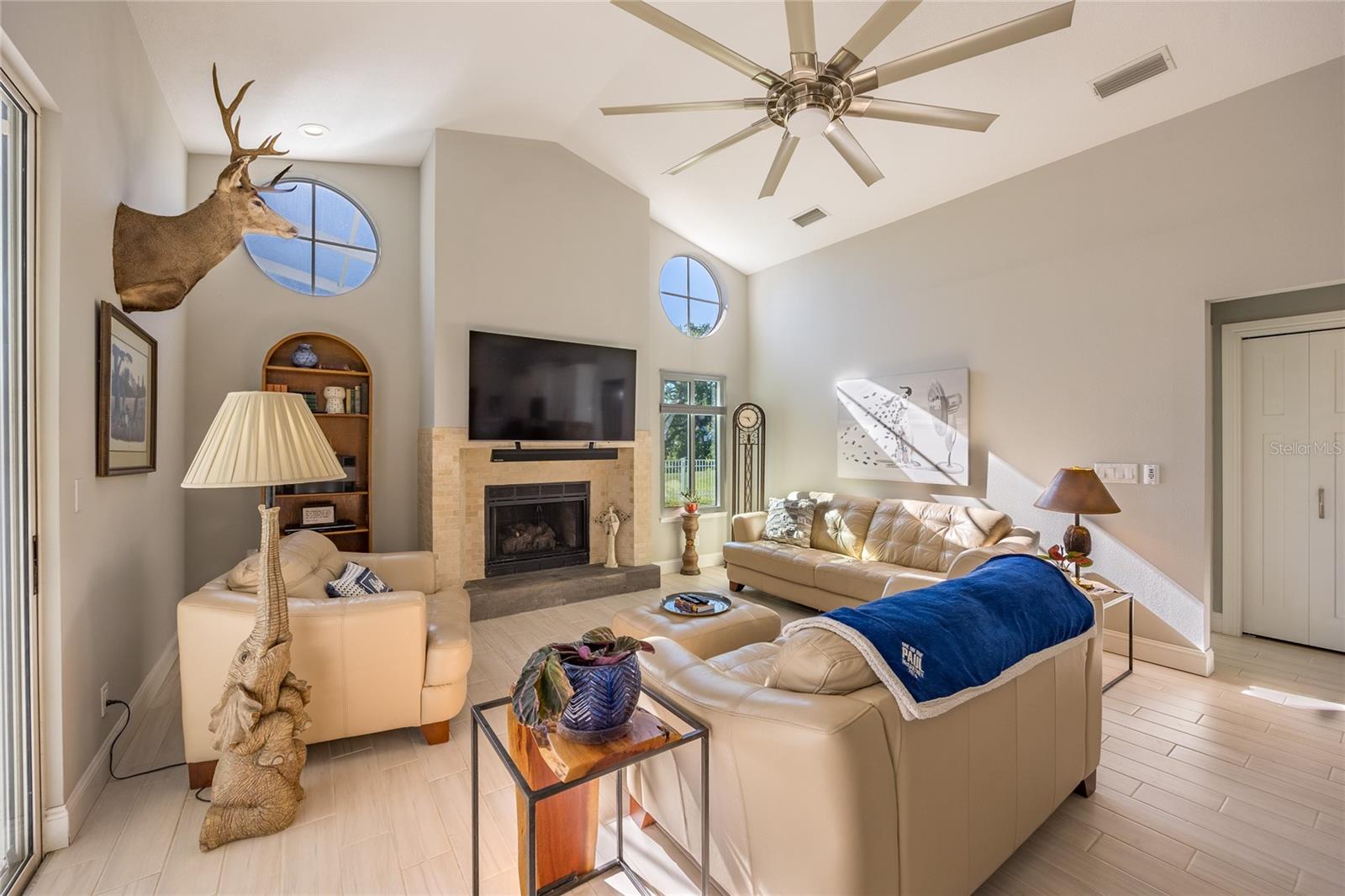 OVERSIZED MATCHING FANS W/LIGHTS IN GATHERING AND DINING AREA!