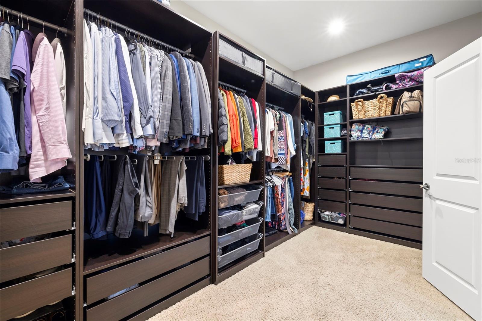 PRIMARY ENSUITE WALK-IN CLOSET WITH CLOSET ORGANIZERS