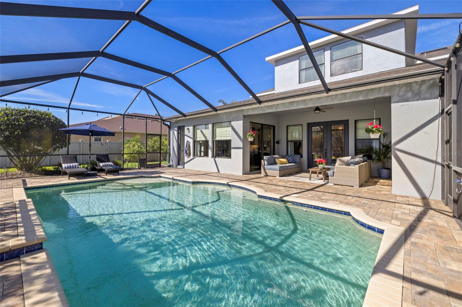 SCREENED PATIO W/ INGROUND POOL WITH WATERFALL