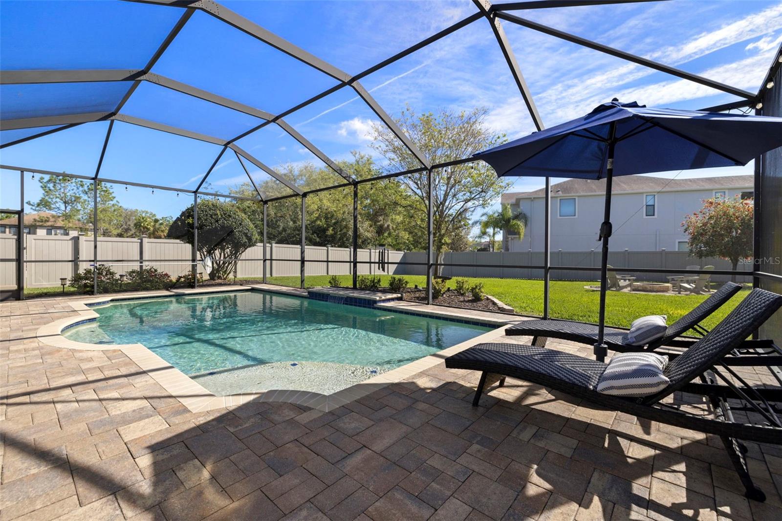 LARGE SCREENED POOL W/ WATERFALL