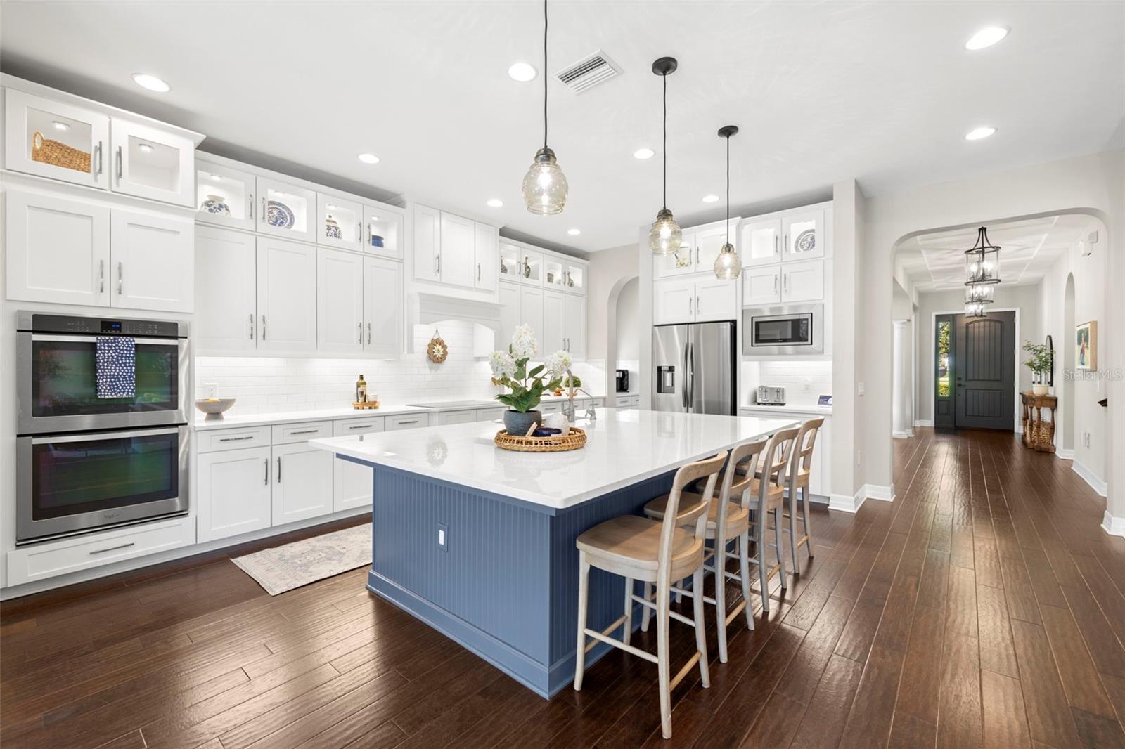 LARGE OPEN KITCHEN WITH LARGE CENTER ISLAND WITH STORAGE