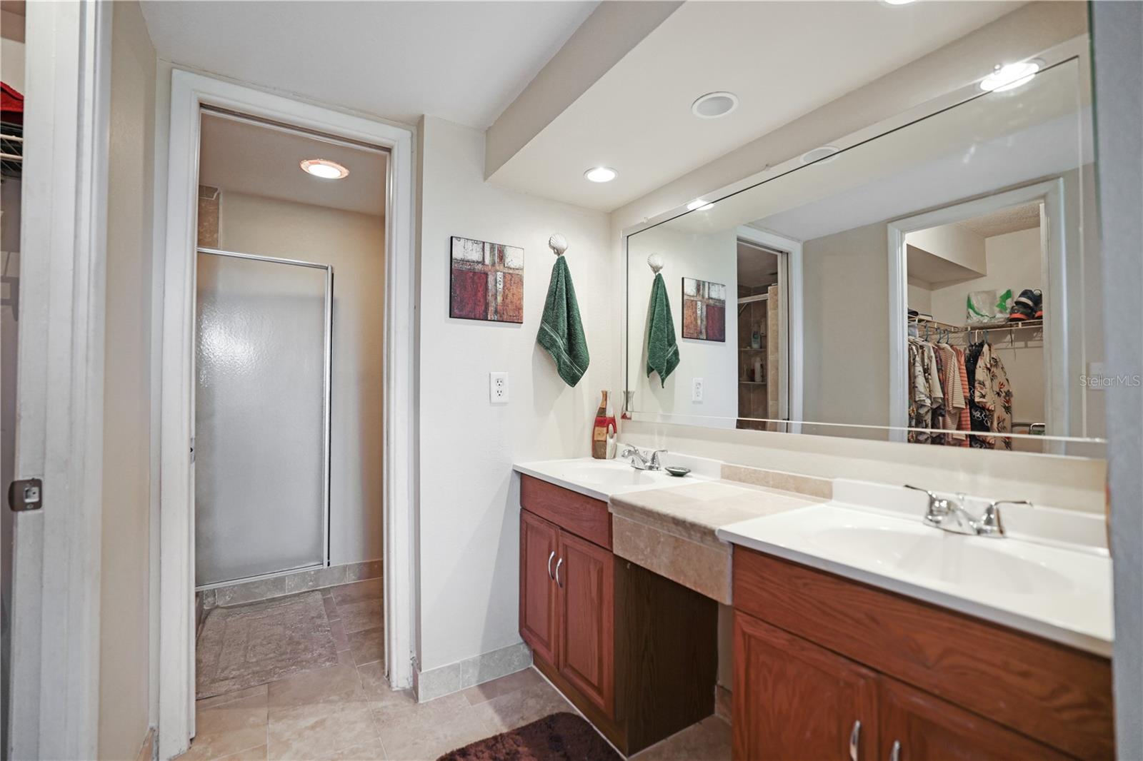 Dual vanities in primary bedroom ensuite bath