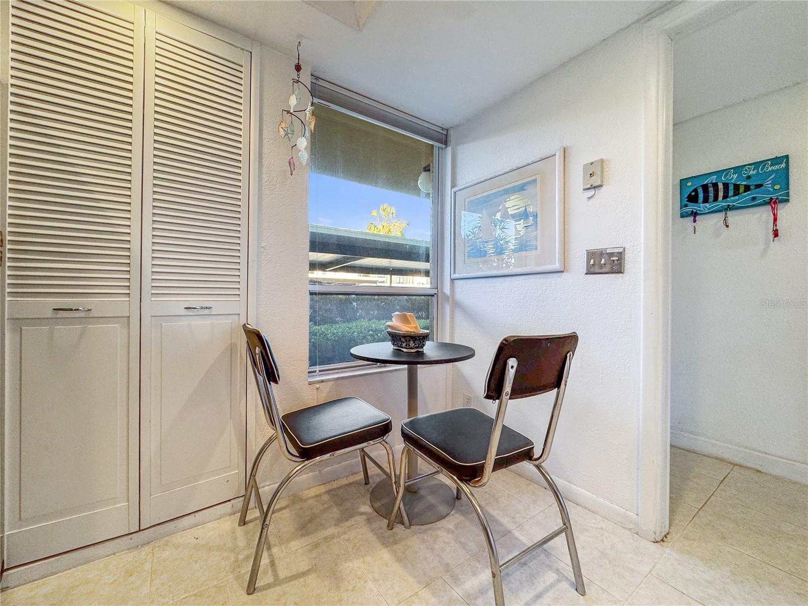 Small eat-in area of the kitchen with a window to the front.