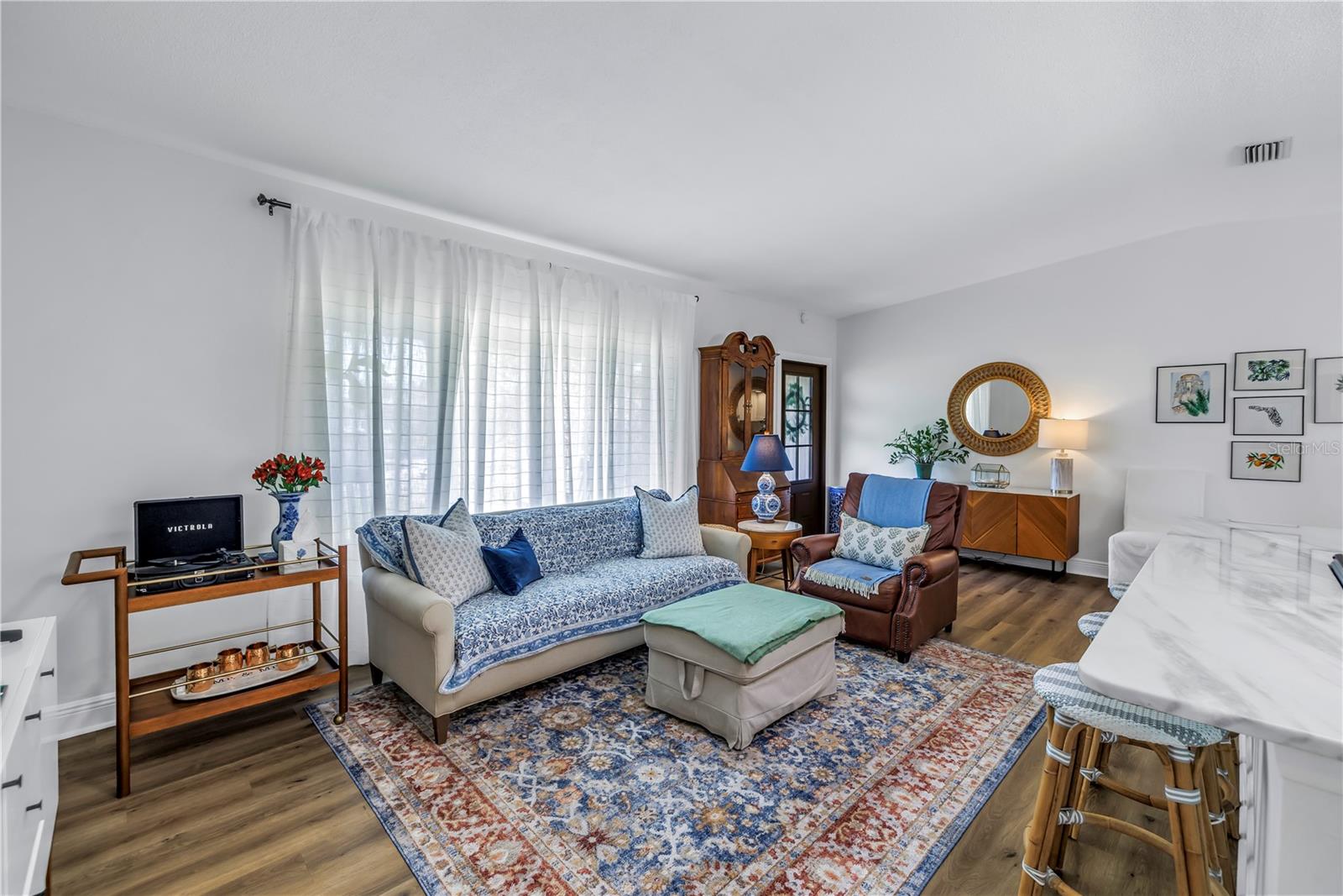 Living room open to kitchen area.