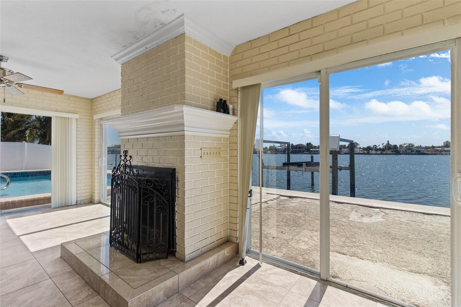 The family room has a wood burning fireplace and open water views.  The fireplace hasn't been used in many years but it is so nice to have.