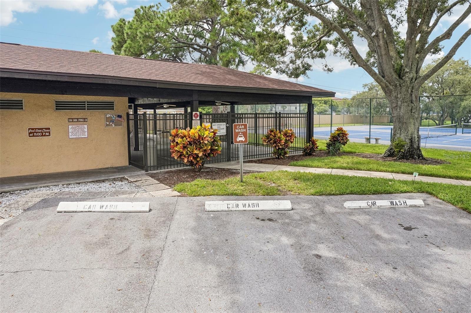 Car wash next to the pool.