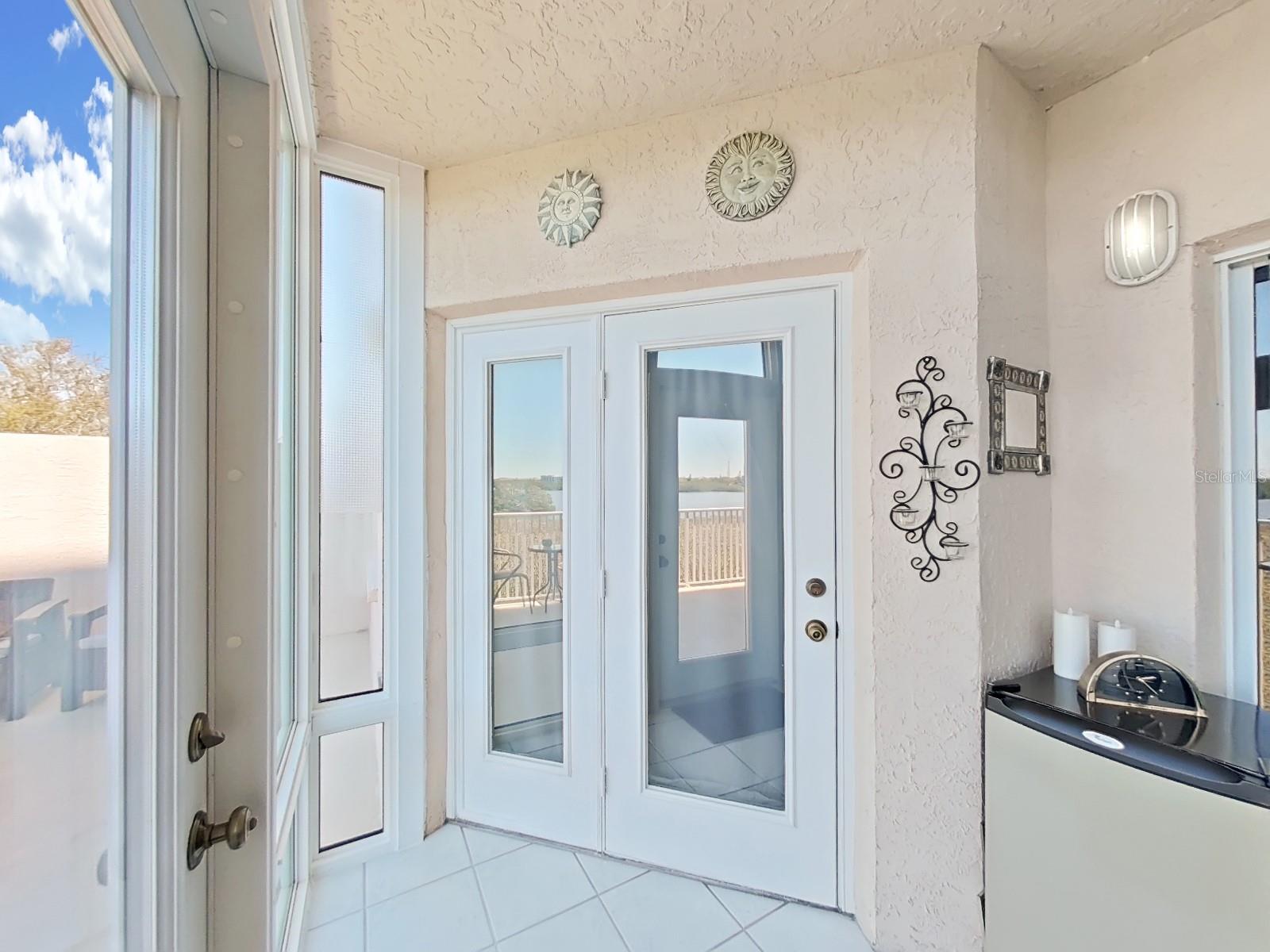French door connects primary suite to sunny lanai