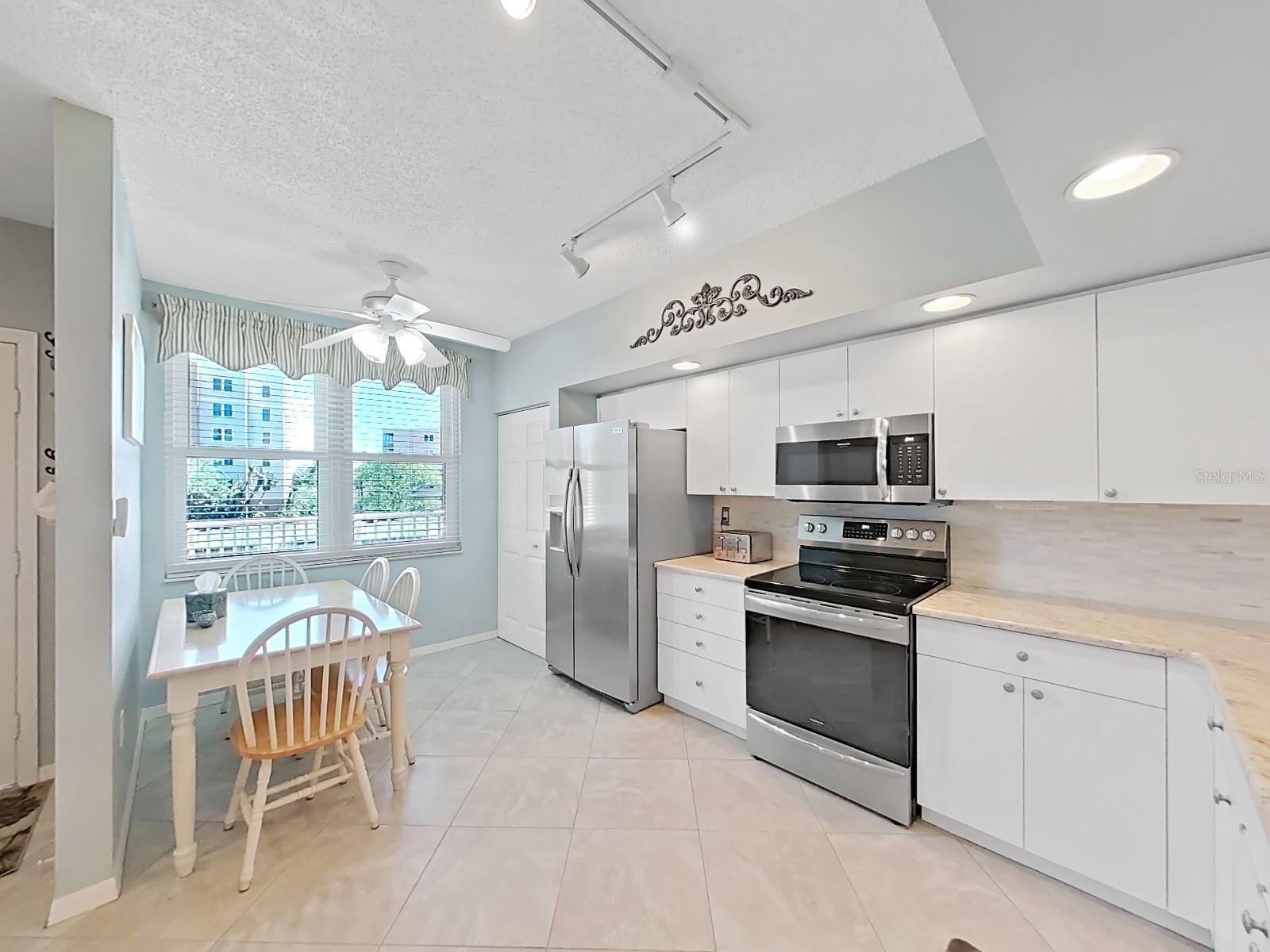 Spacious kitchen with stainless appliances . . .