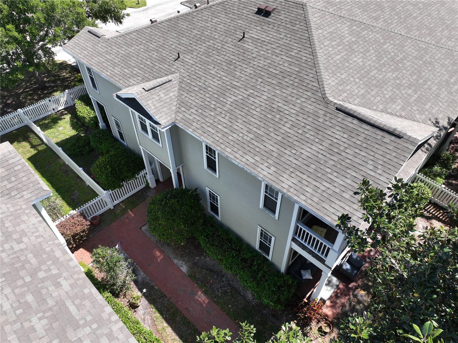 City Home Aerial/Sidewalk Leading to Entrance