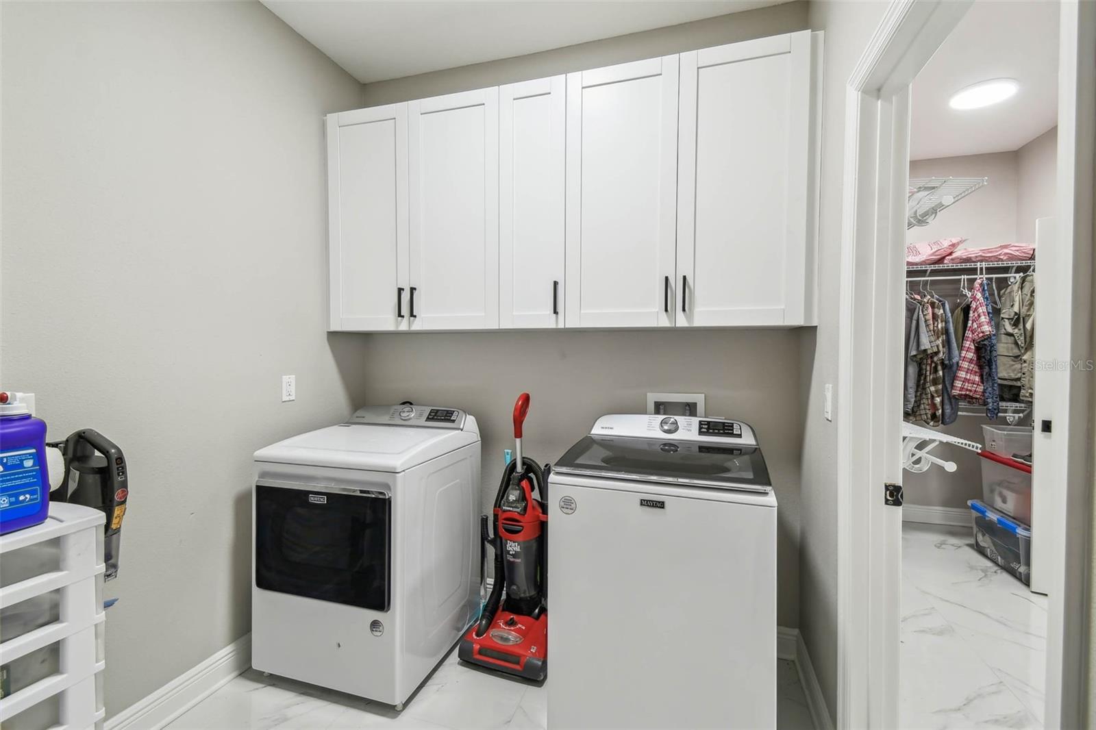 laundry room connecting to primary bedroom closet