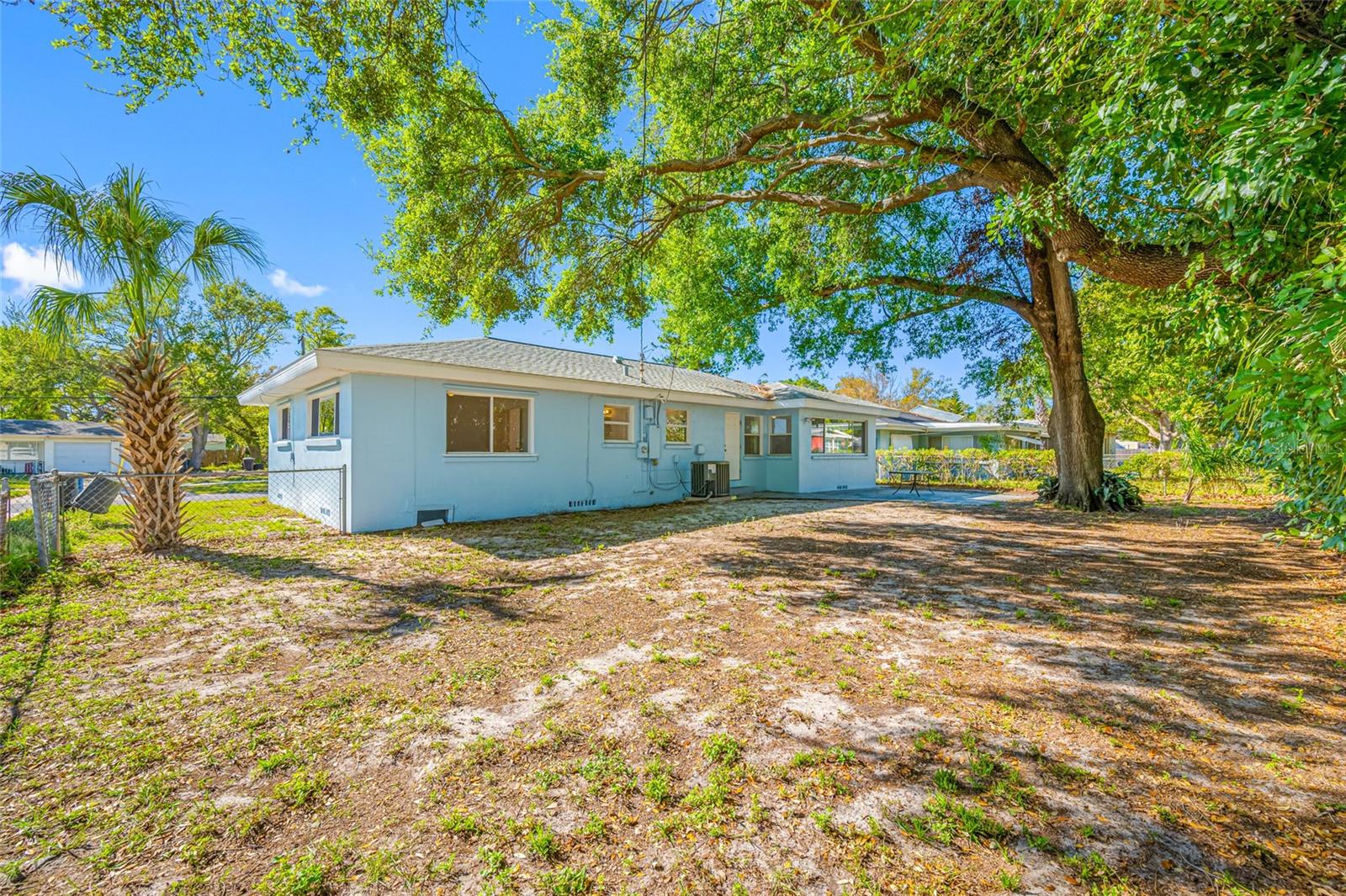 Tree shaded fenced yard