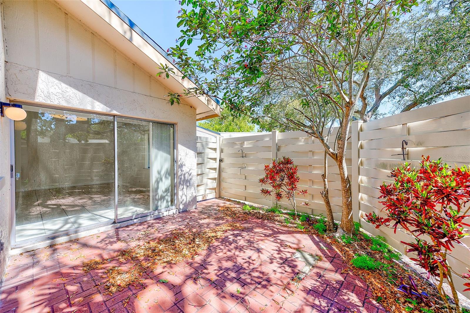 Fenced wrap-around patio