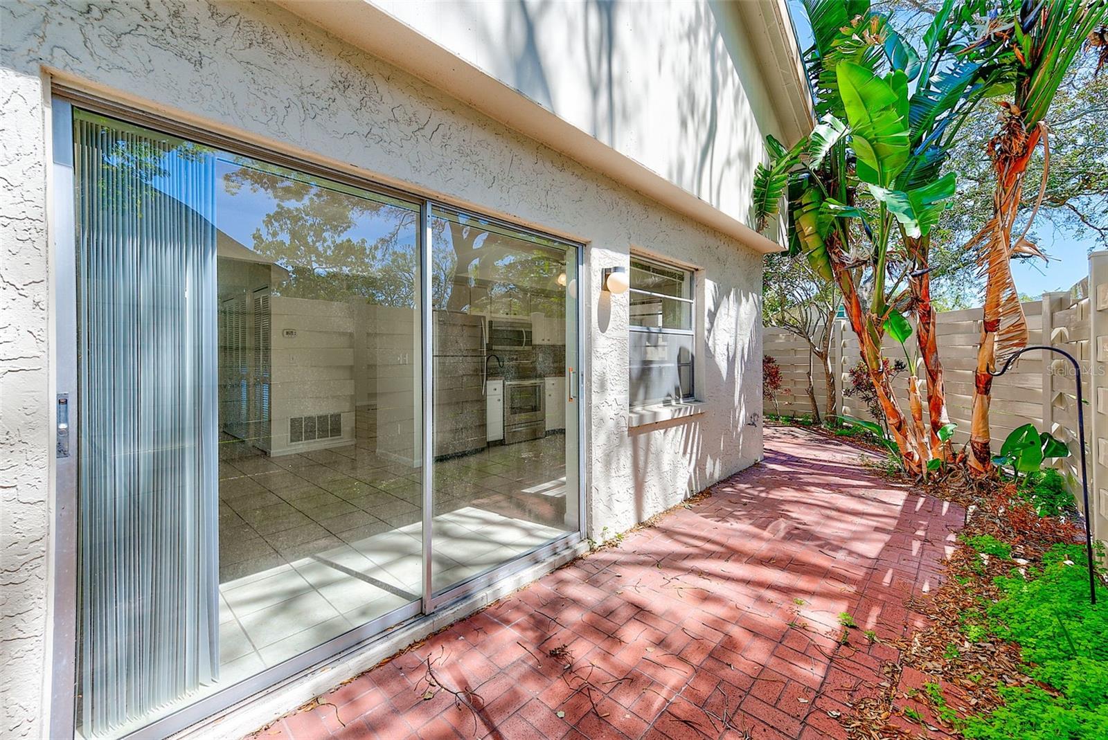 Fenced wrap-around patio