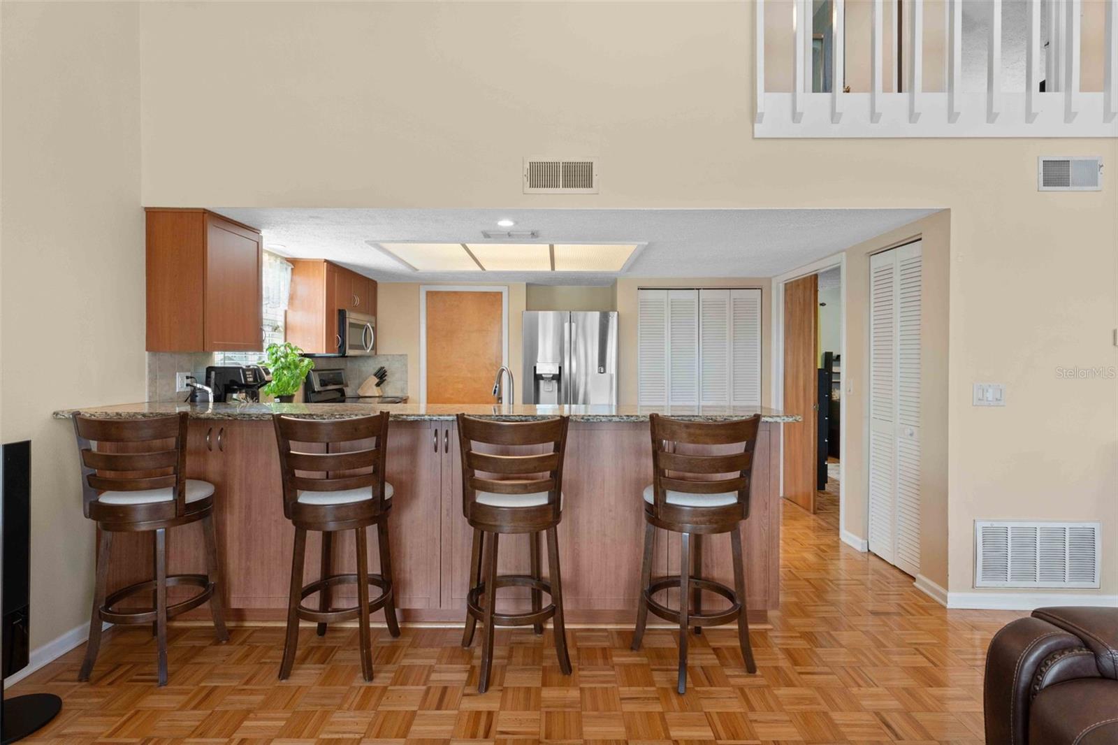 Breakfast Bar with Banquet Side Cabinets