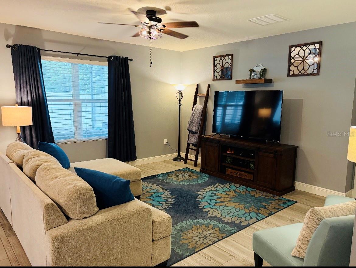 Family room removing some furniture, to show how spacious it is