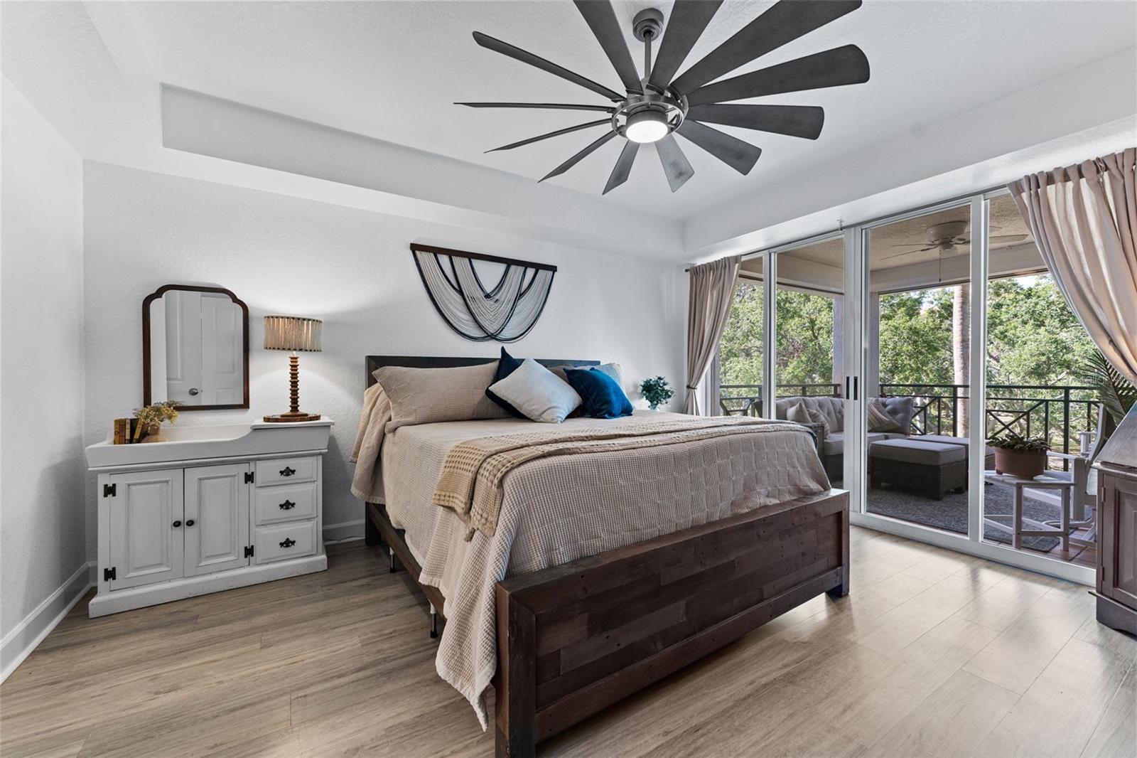 Primary bedroom, with access to large balcony and ensuite bathroom