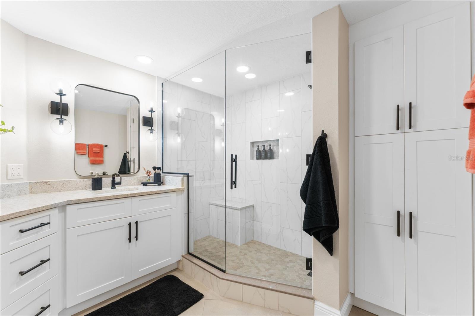 The primary ensuite bathroom has been completely re-built.  Note the extra storage to right of shower