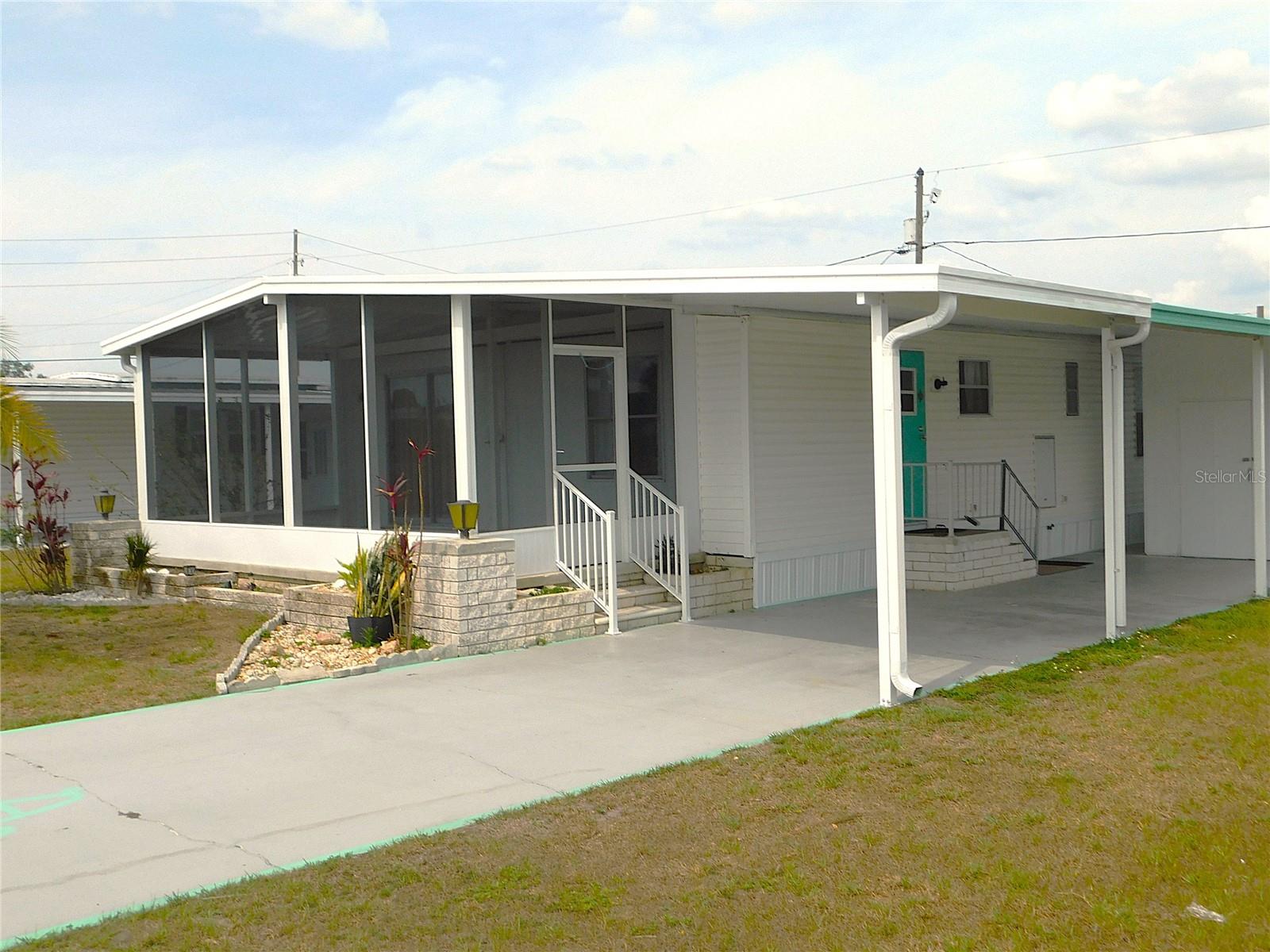 AFTER NEW SCREEN PORCH AND ADDITIONAL CARPORT