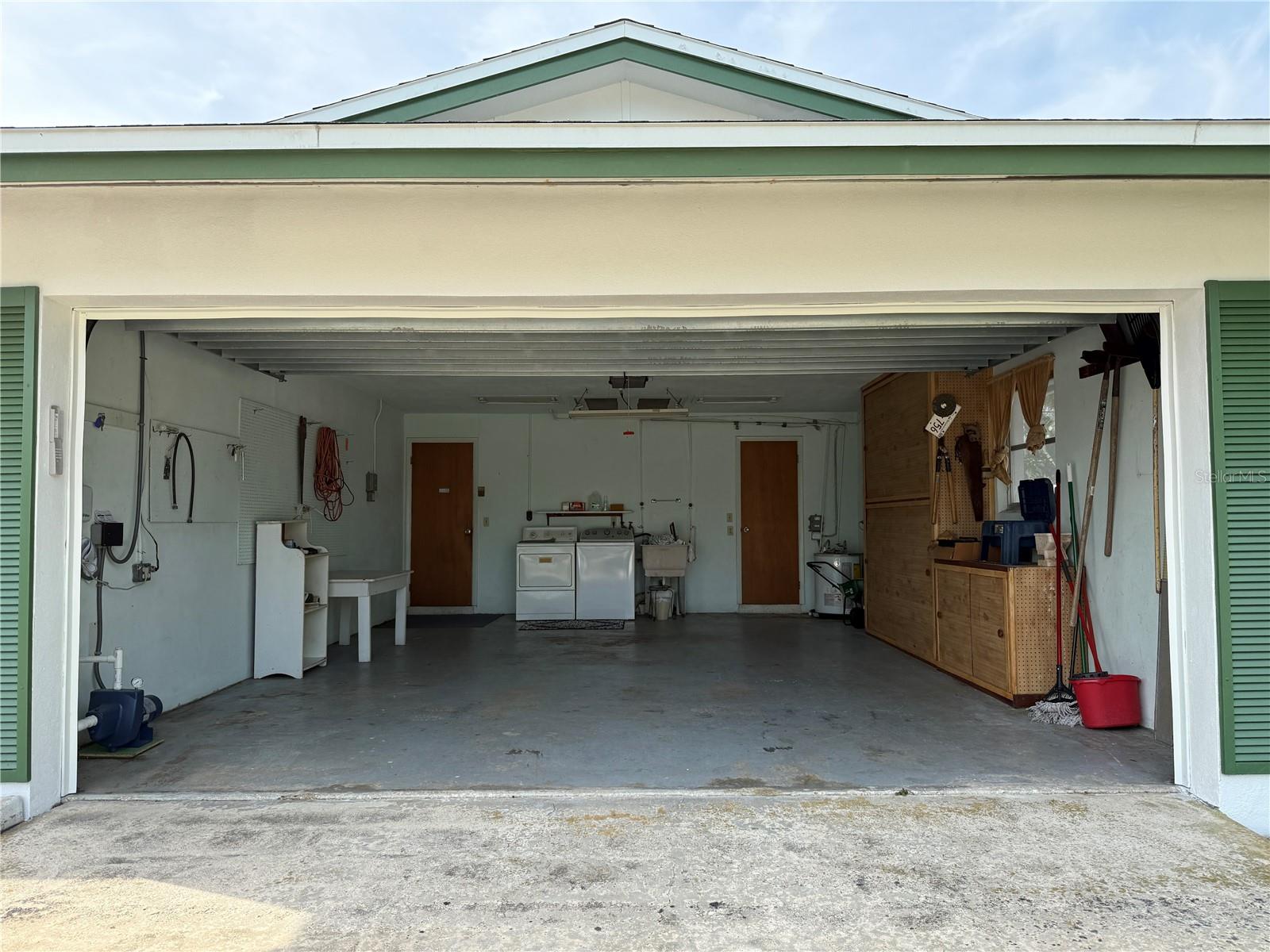 Two car garage with laundry and built in cabinet space