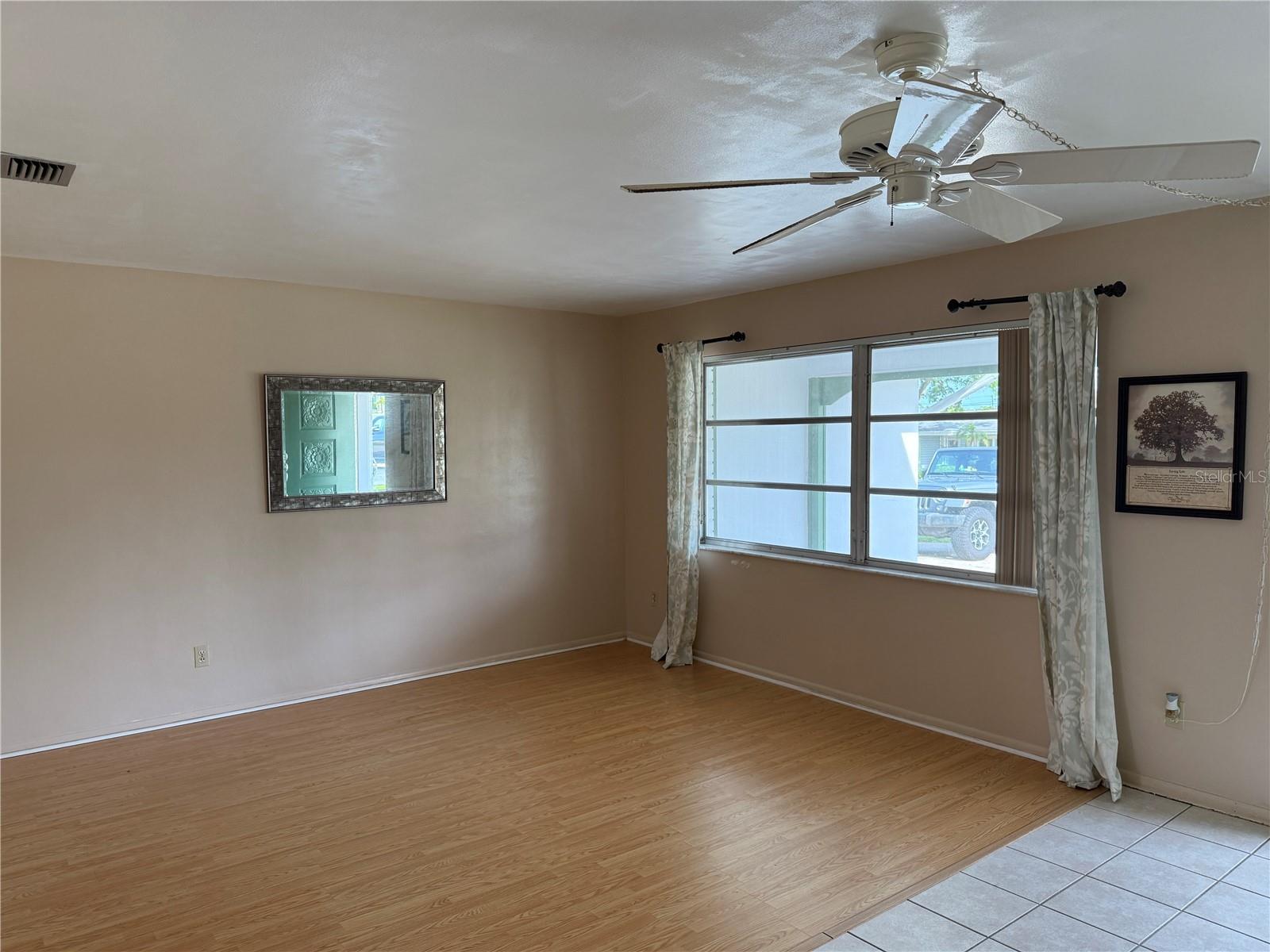 Spacious family room with wood floors