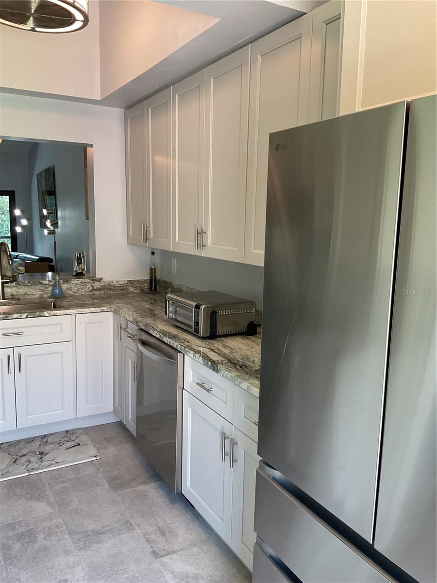 KITCHEN WITH NEW CABINETS, FLOORING, GRANITE COUNTERTOPS AND NEW APPLIANCES