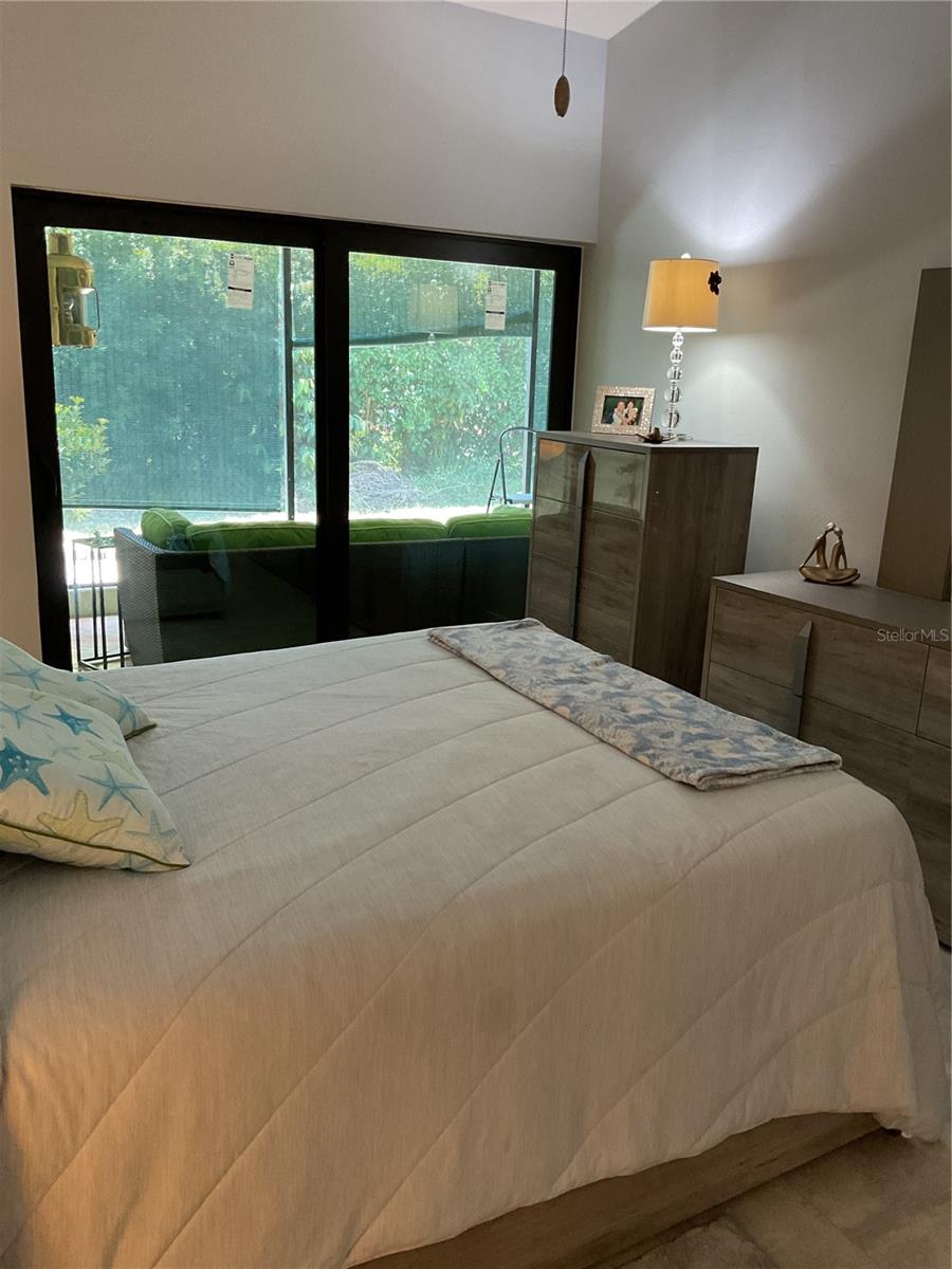 MASTER SUITE WITH SLIDERS OUT TO PATIO