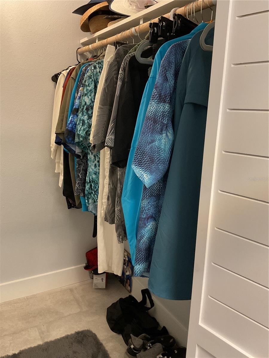 MASTER WALK-IN CLOSET WITH STORAGE ON BOTH SIDES