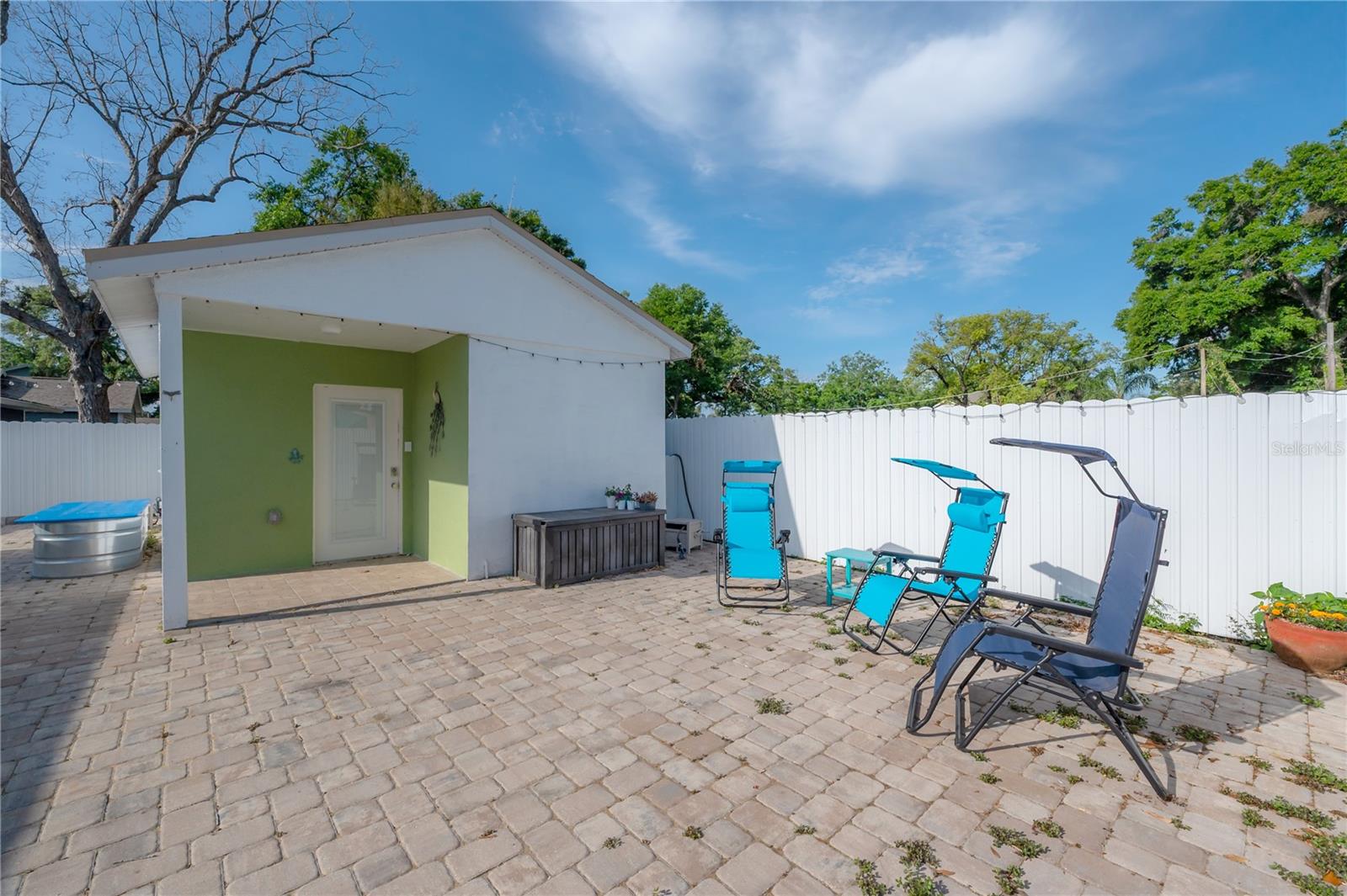 Paver covered rear area and Guest House
