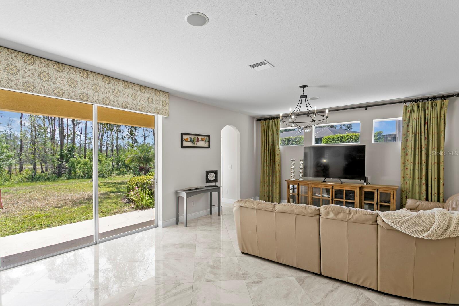 The oversized family room runs across the back of the home