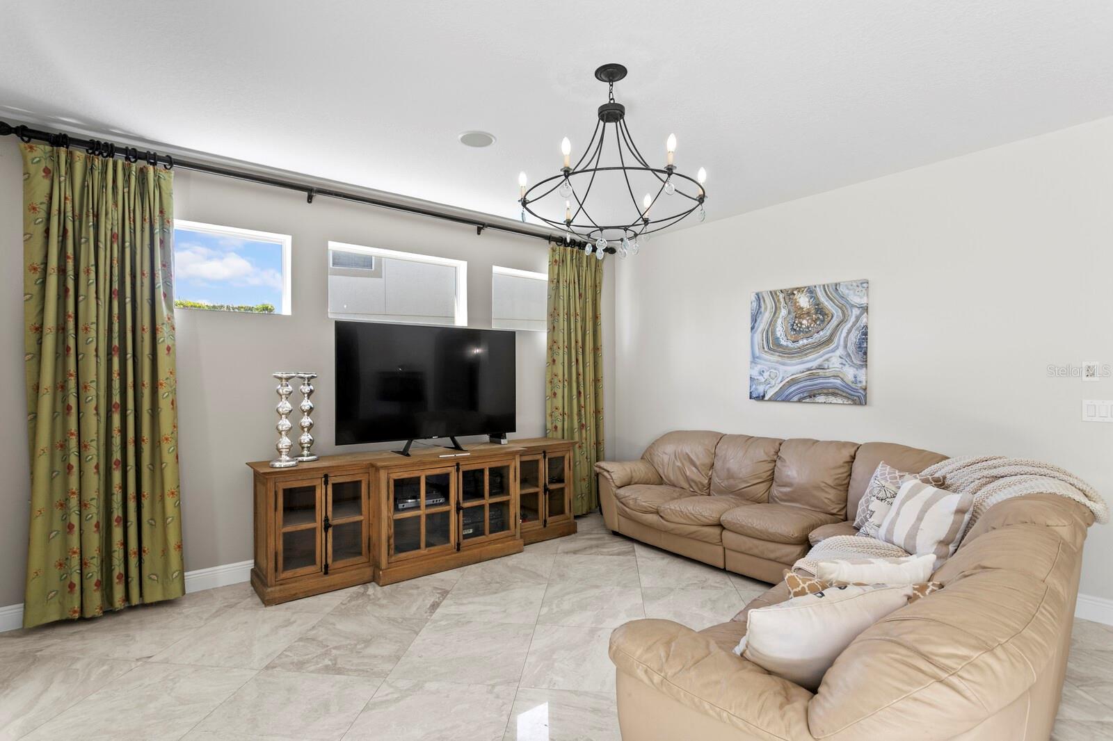 Transom windows allow plenty of natural light in the family room