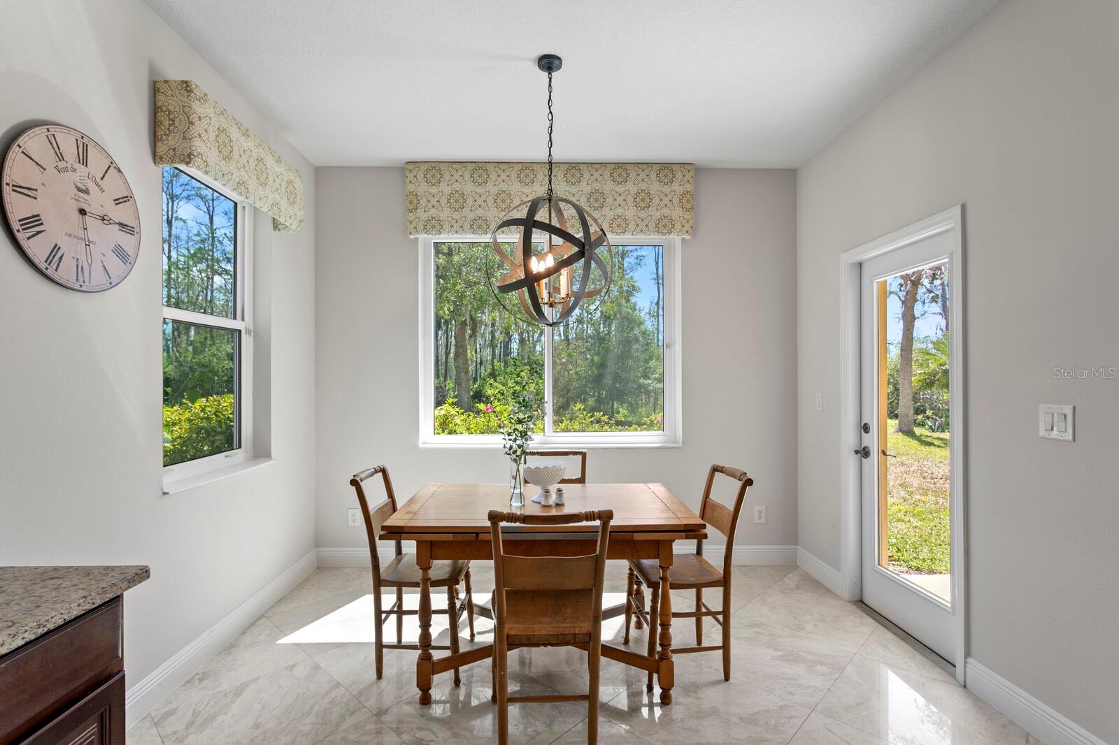 Enjoy casual dining and backyard views in the dinette