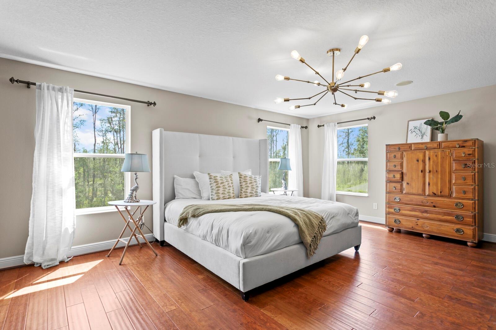 The primary suite spans the entire width of the home