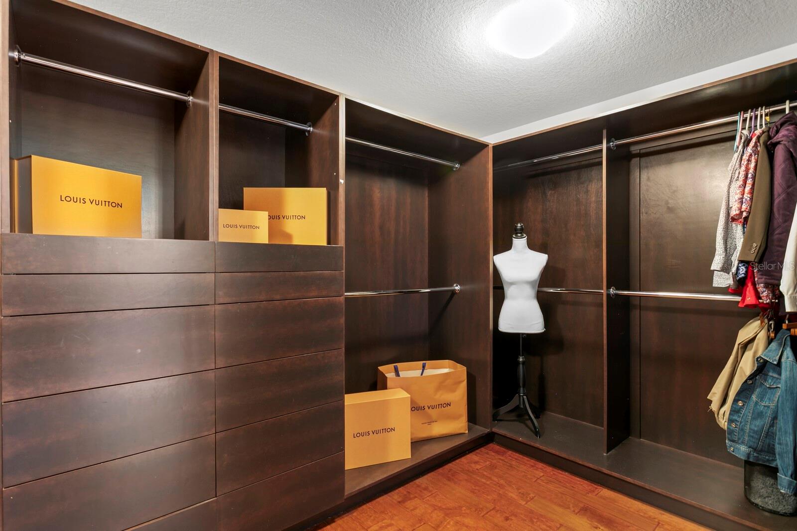 Custom built-in closet system in the primary suite