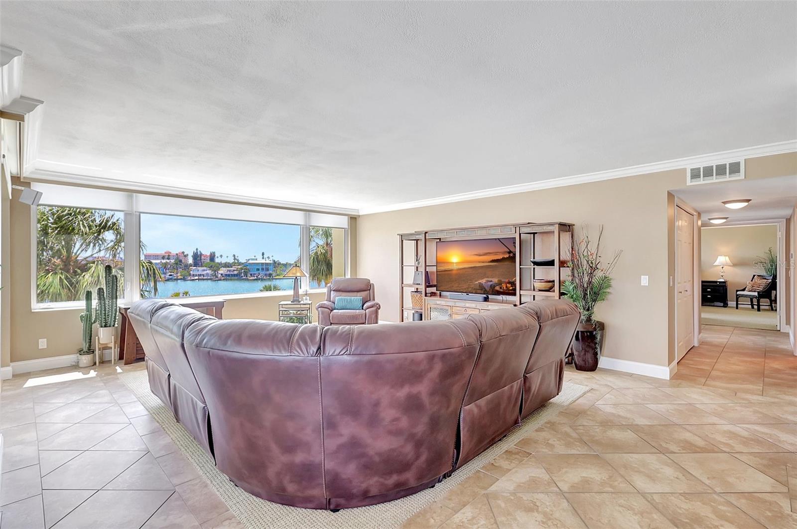 The living froom is large, with a beautiful view and new Remote blinds