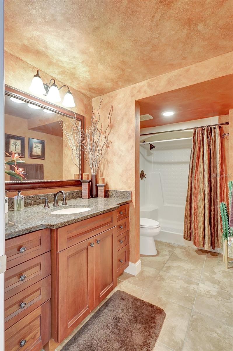 The Guest bathroom, also wll appointed with plenty of storage and a walk in shower