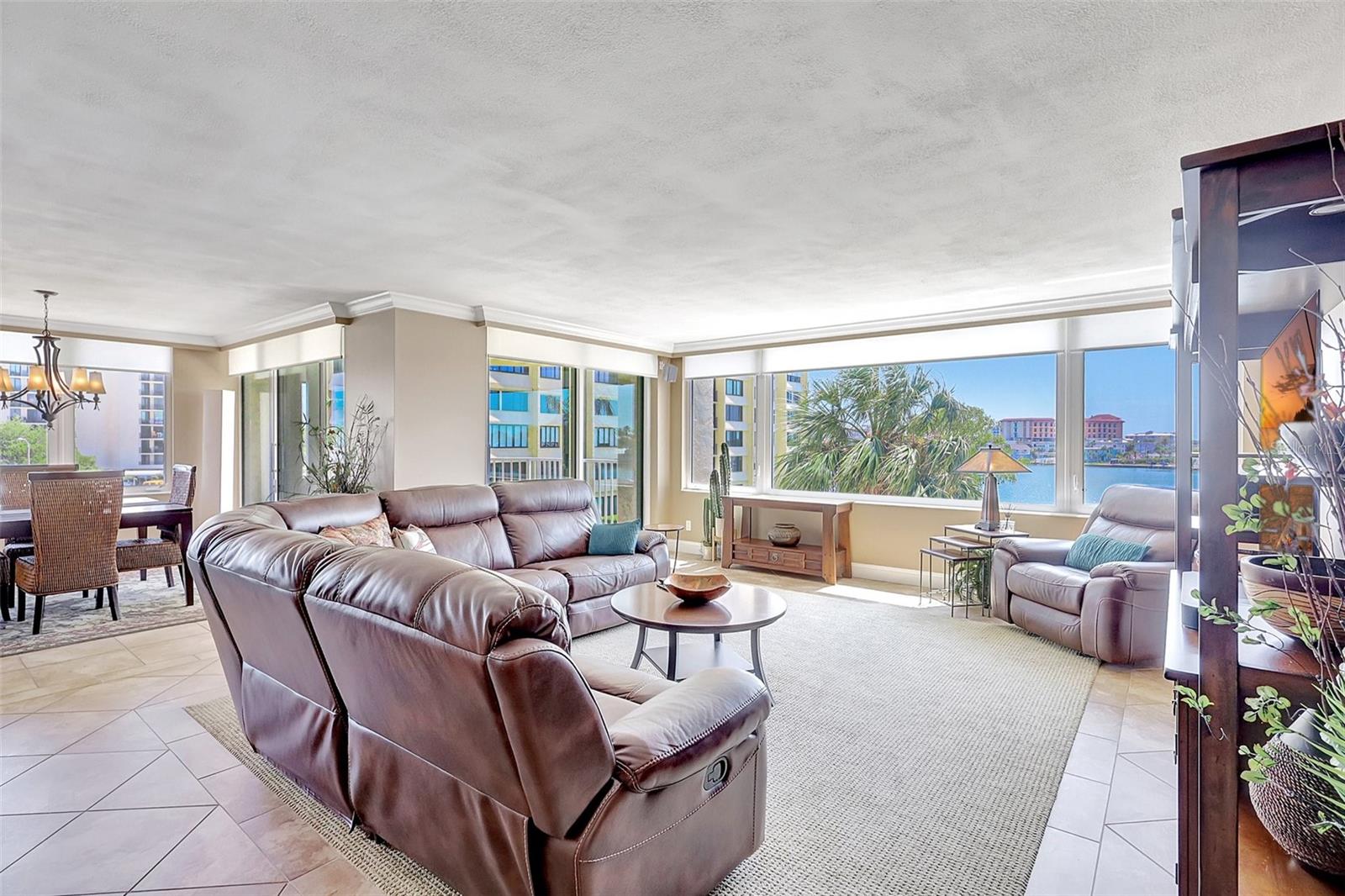 As you enter the living space, you are met by the view through the new windows and sliders which lead out to the balcony from the living room and dining area